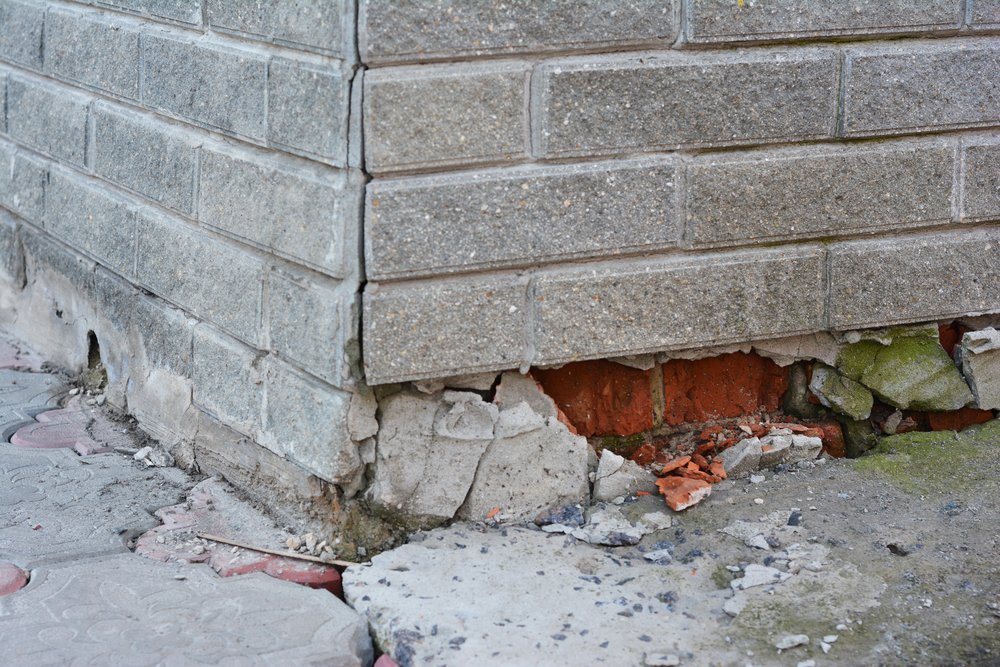 broken foundation house brick wall