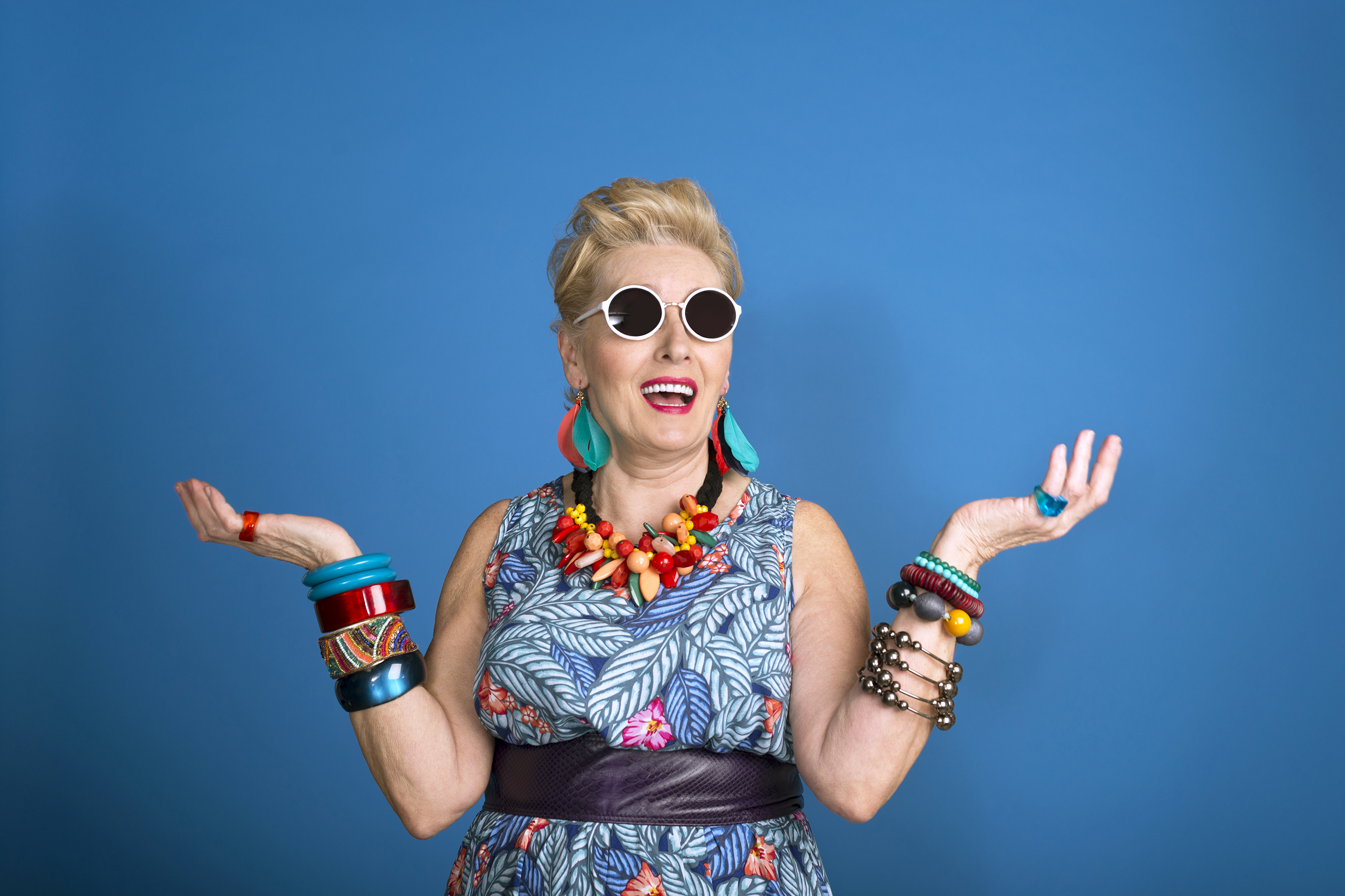 Quirky senior woman wearing bright clothes and jewelry