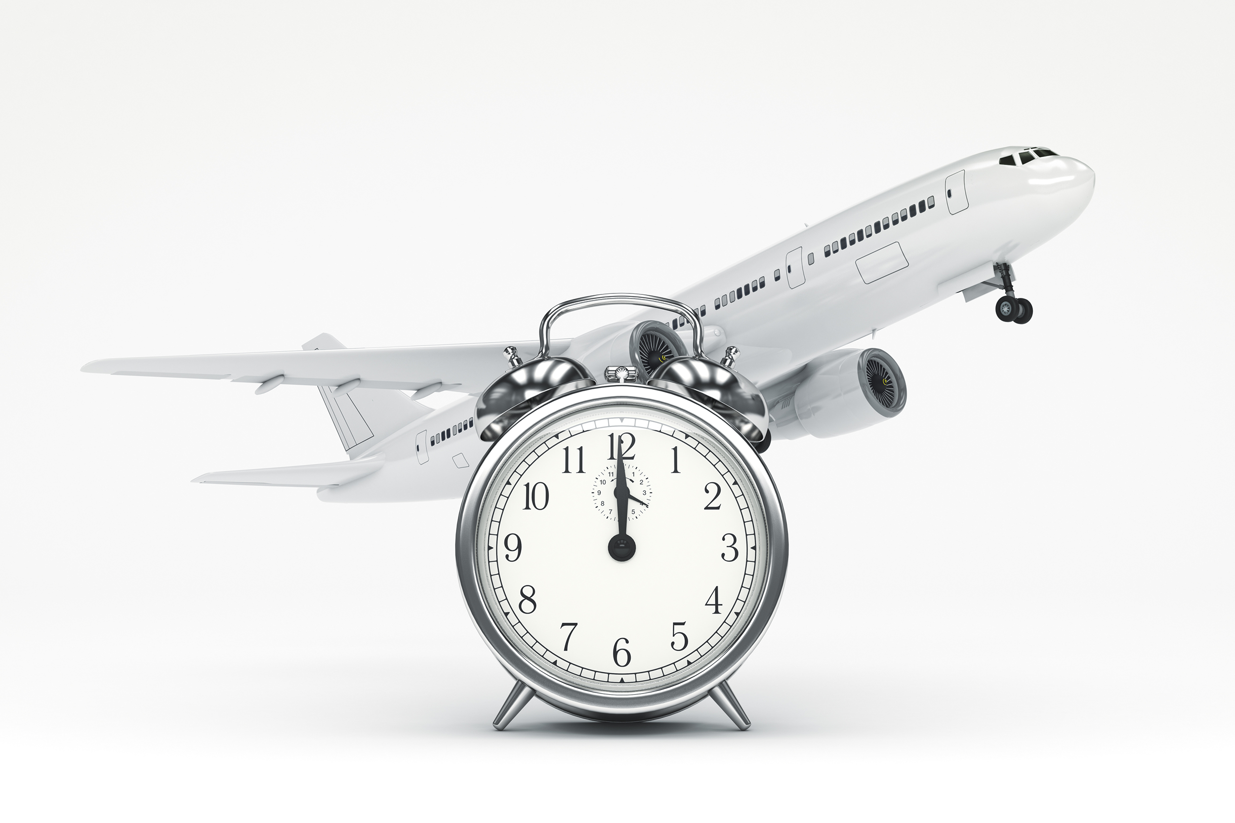 Clock with an airplane behind it