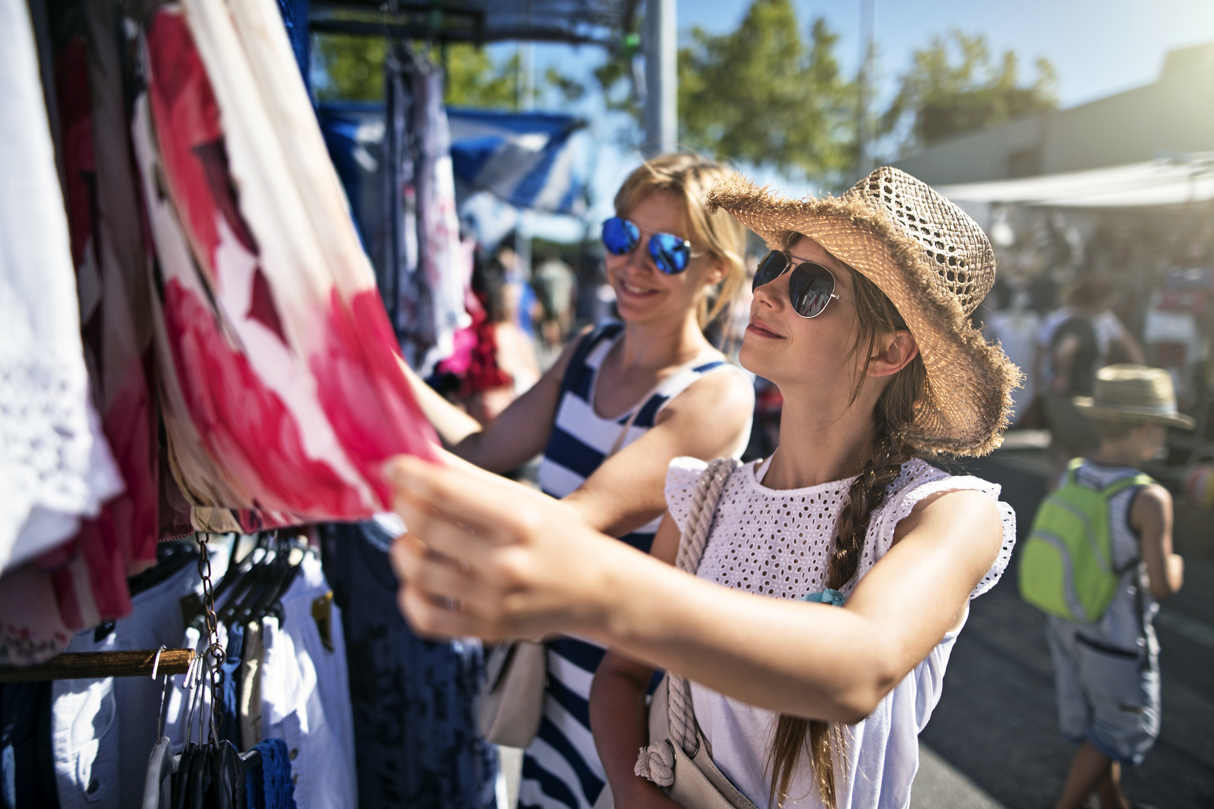 Women tourists shopping at an outdoor market
