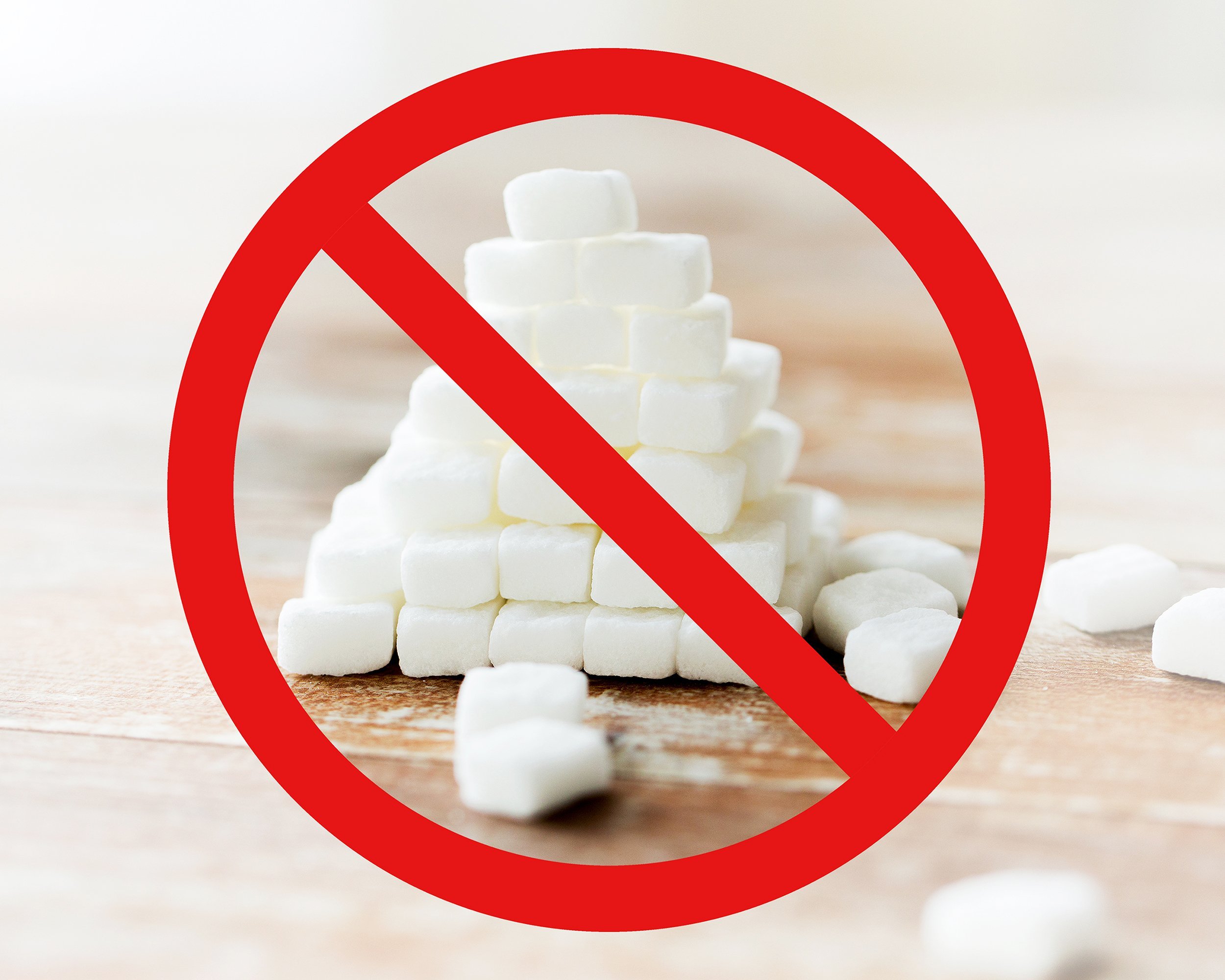 close up of white sugar pyramid on wooden table over red circle-backslash no sign