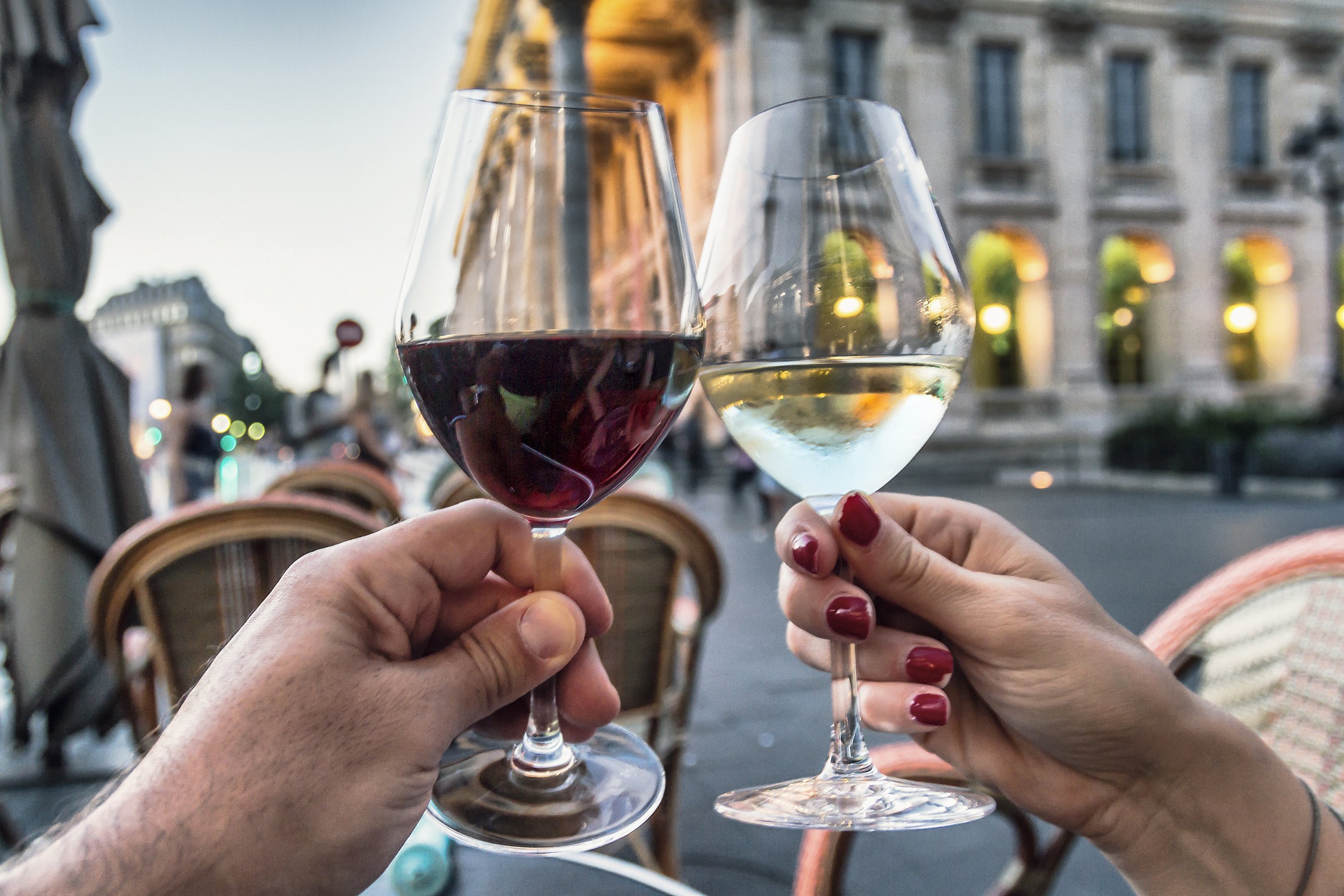 couple raising glasses with wine
