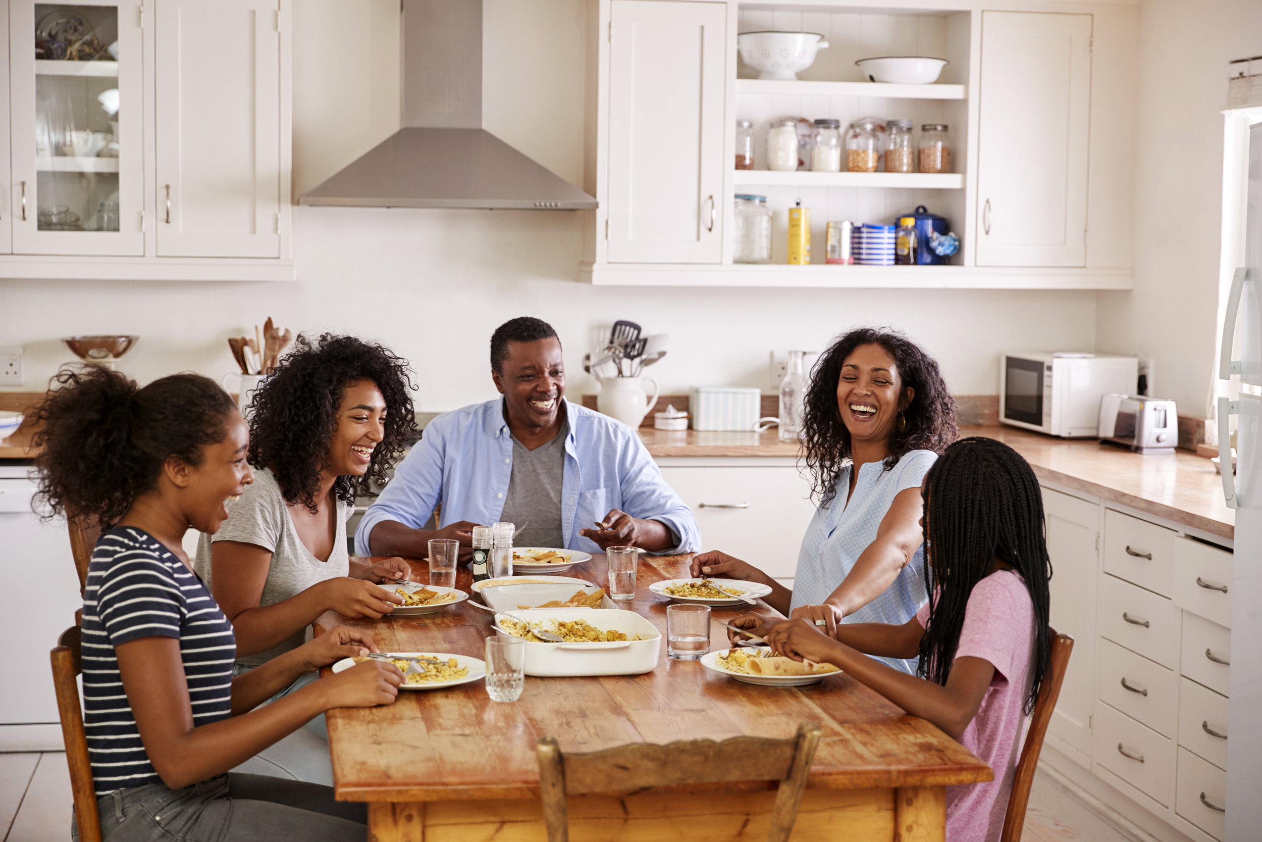 Family eating dinner at the kitchen table