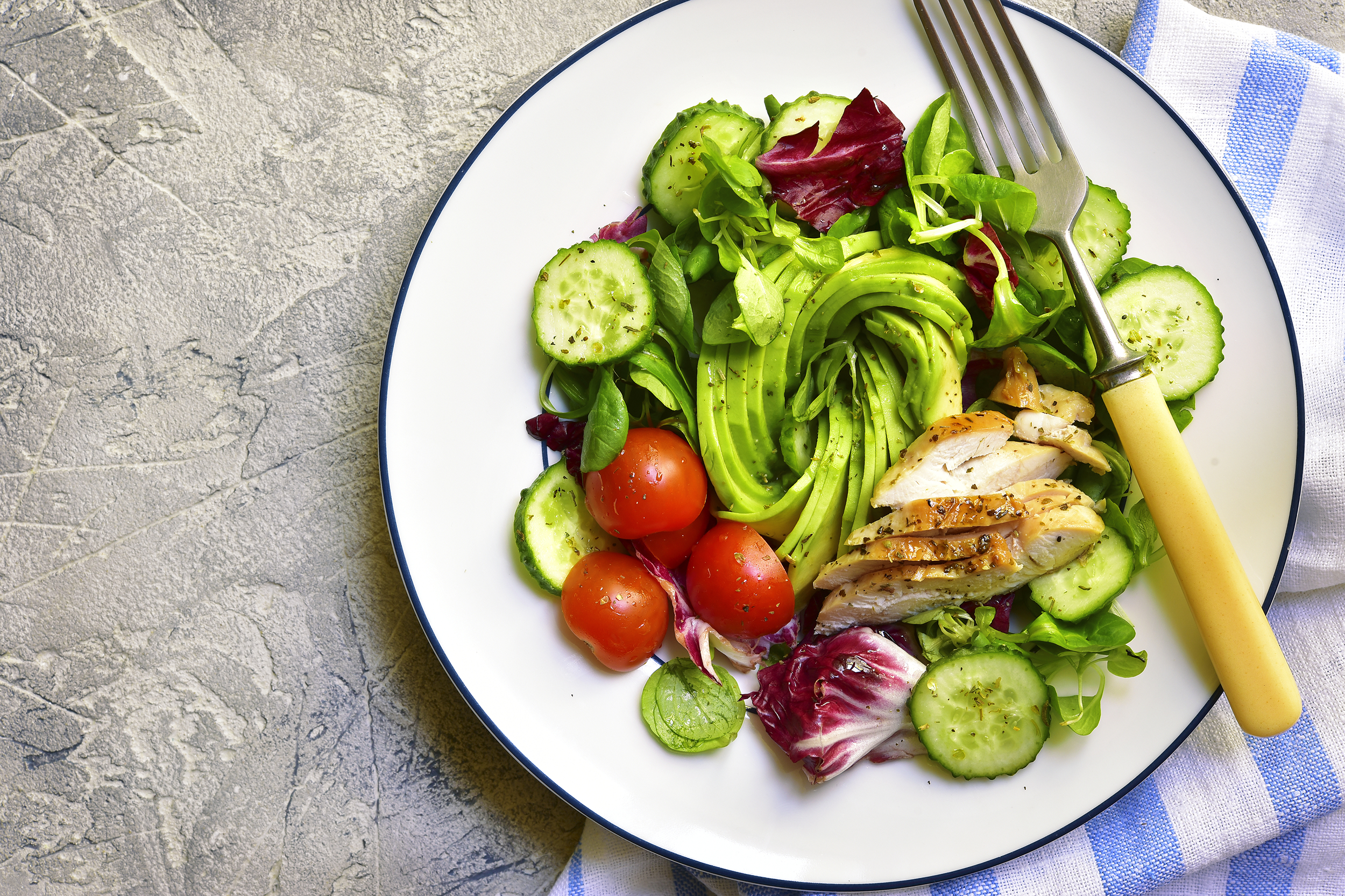 Plate of vegetables and chicken for a paleo diet