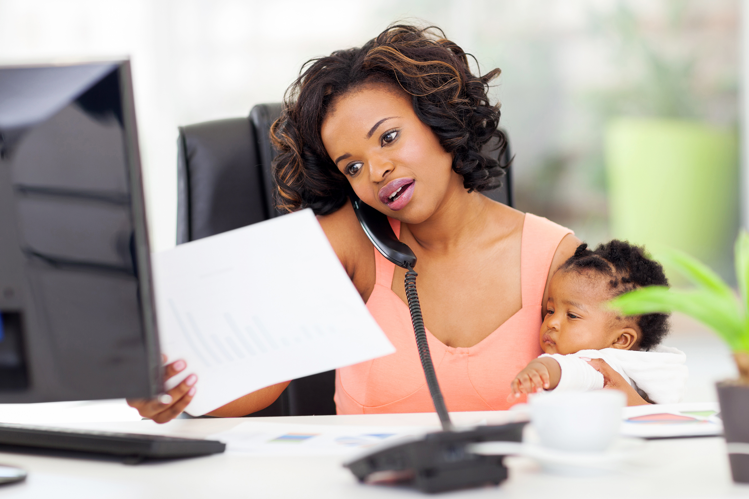 Working mom with her baby at work