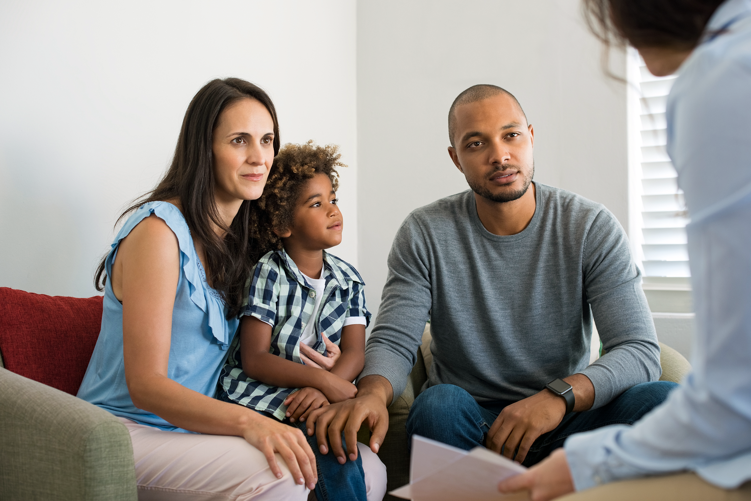 Couple speaking with an adoption counselor