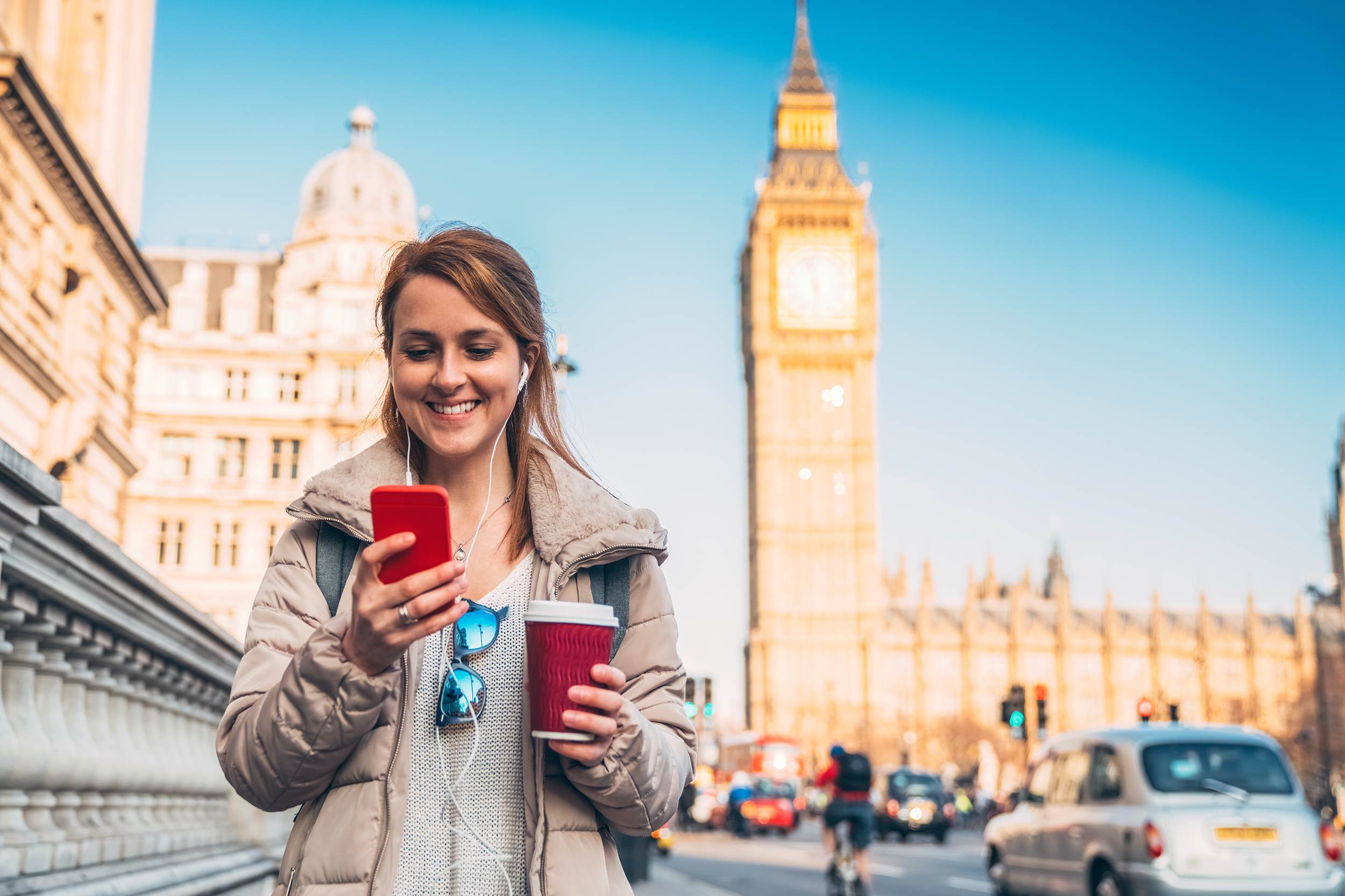 Woman texting on the street in London