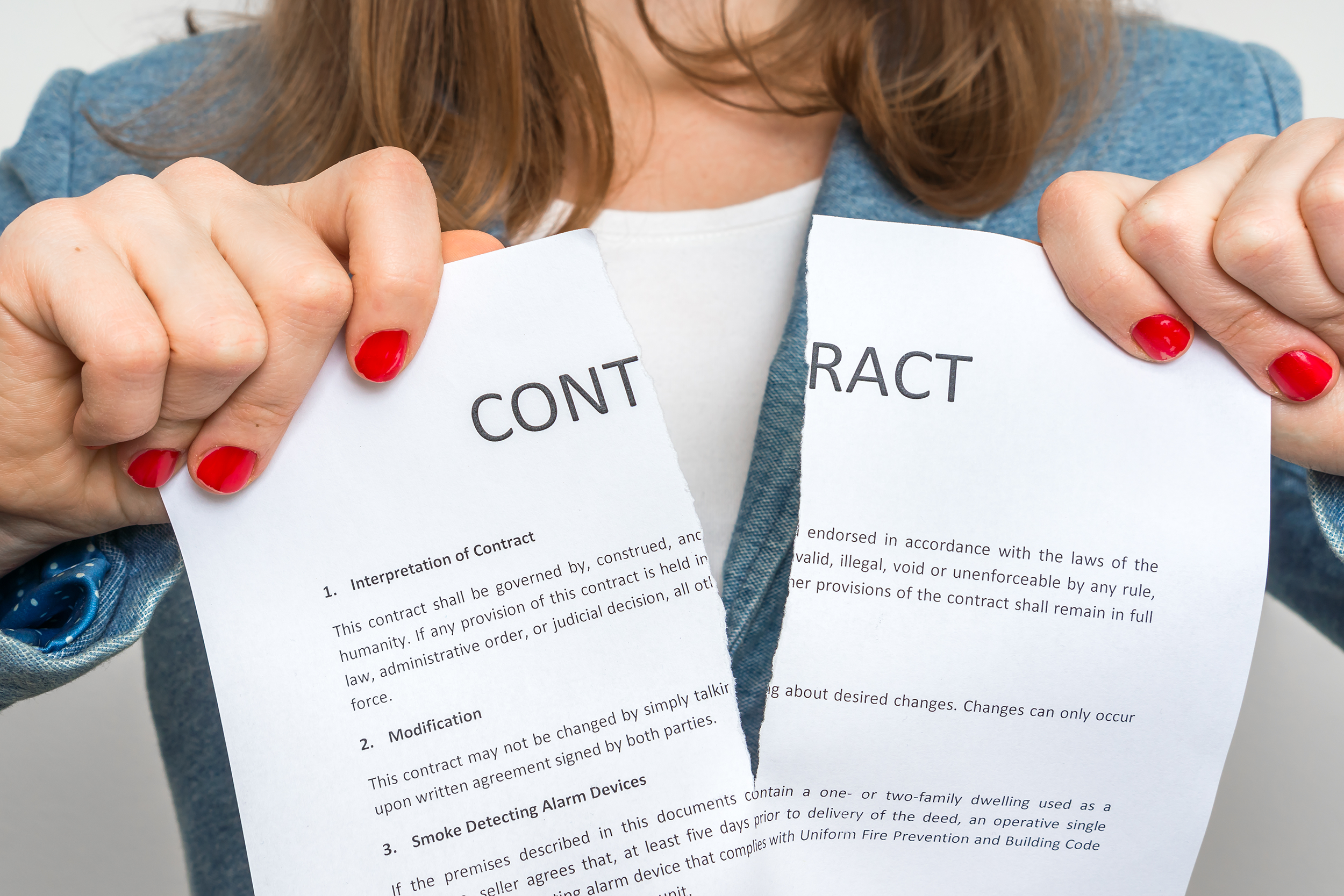 Woman ripping a contract