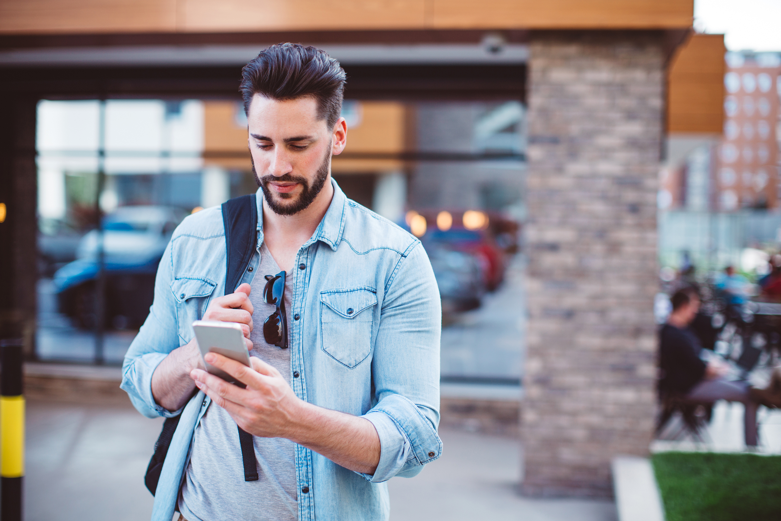 Man using cellphone outside