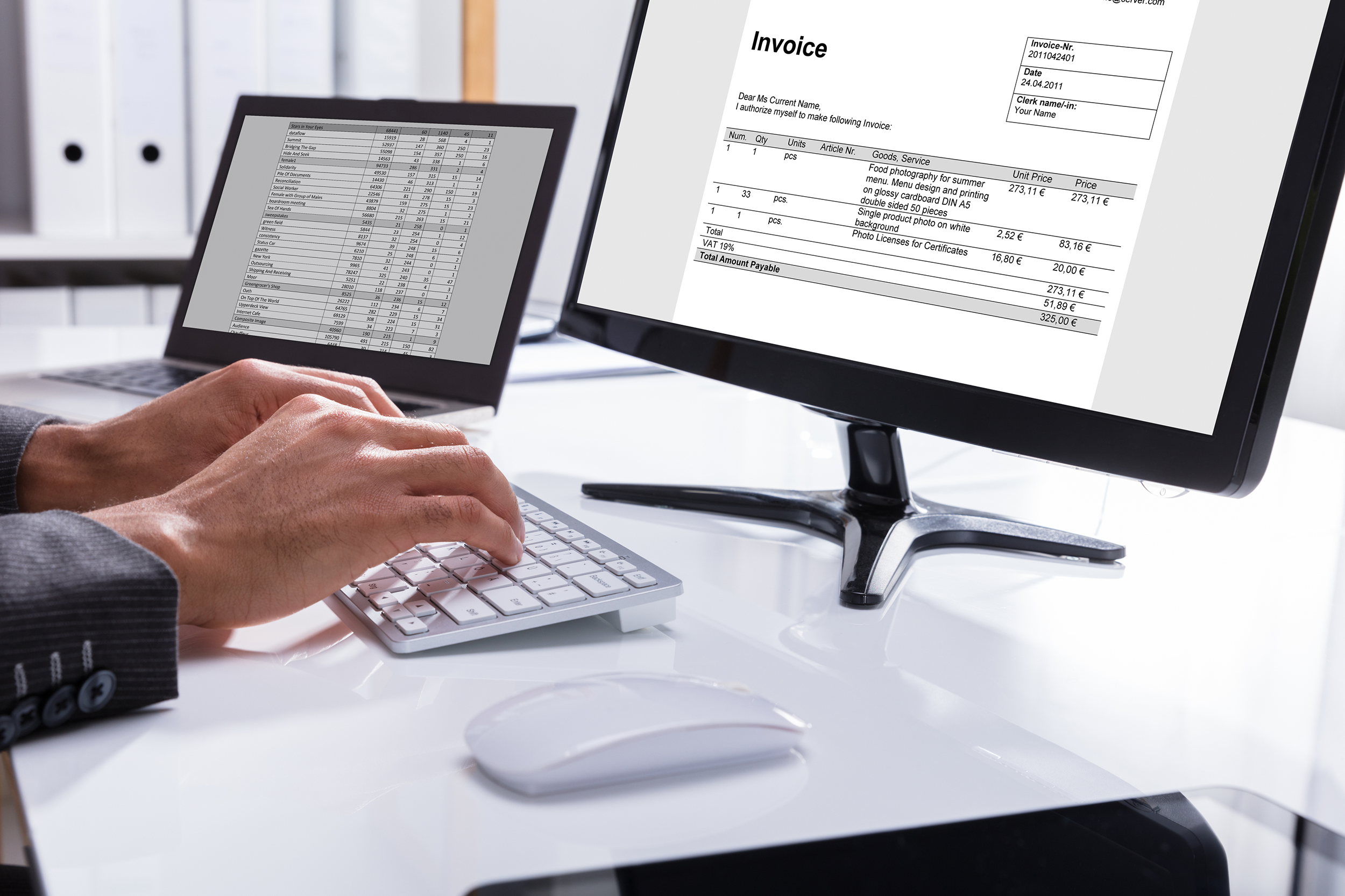 Man paying an invoice on his computer