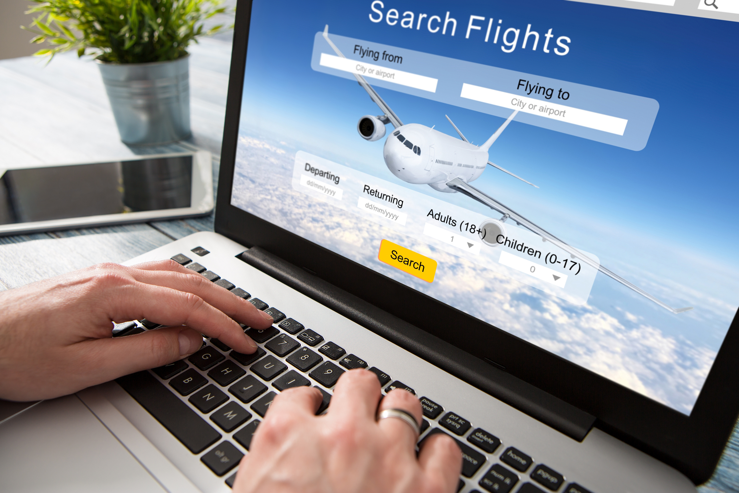 Searching for flights on a laptop