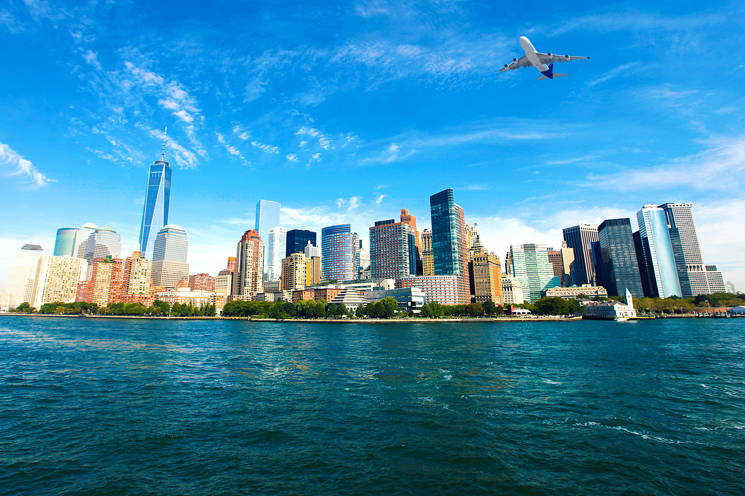 Plane flying over New York City skyline