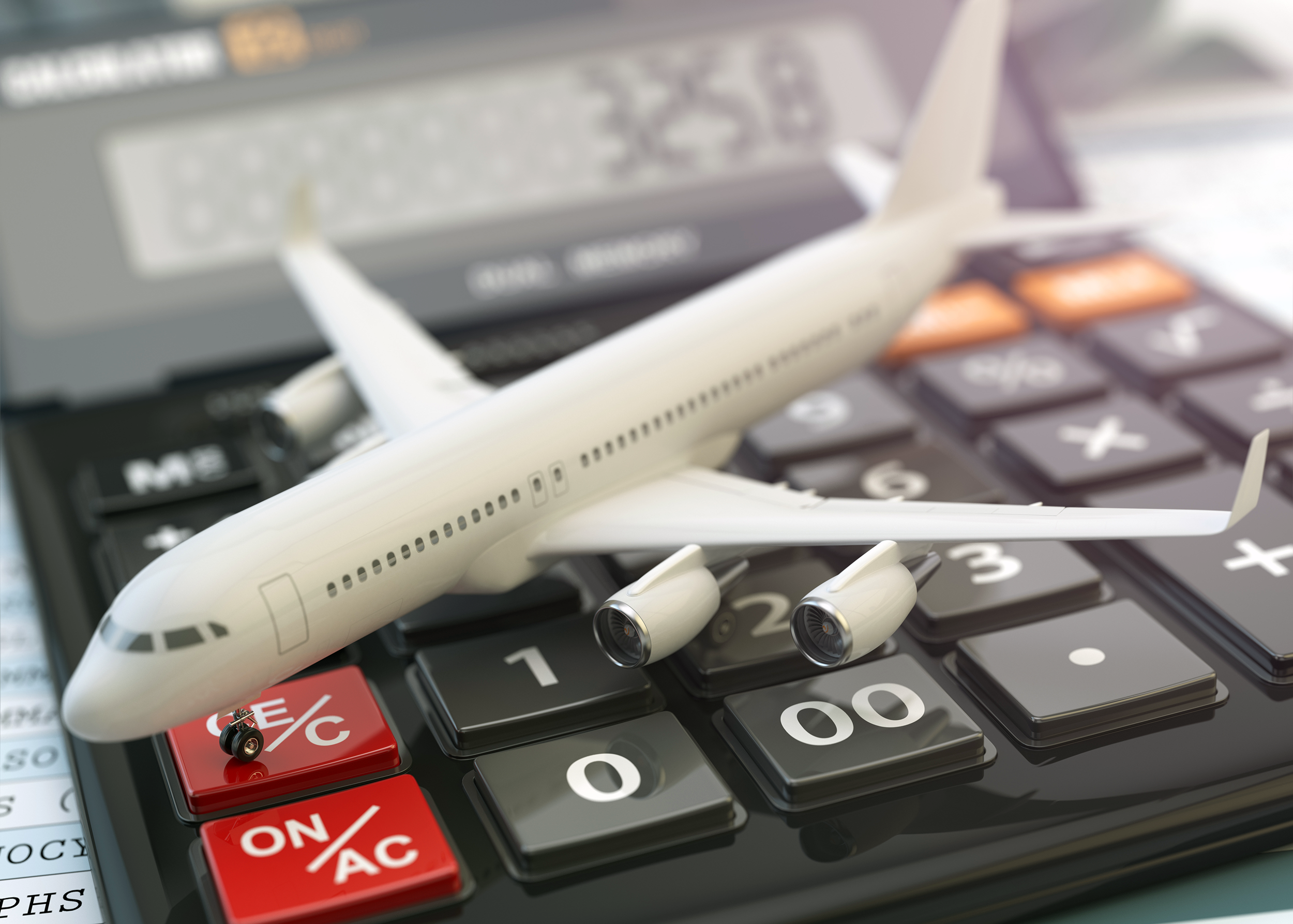 Airplane figurine on a calculator