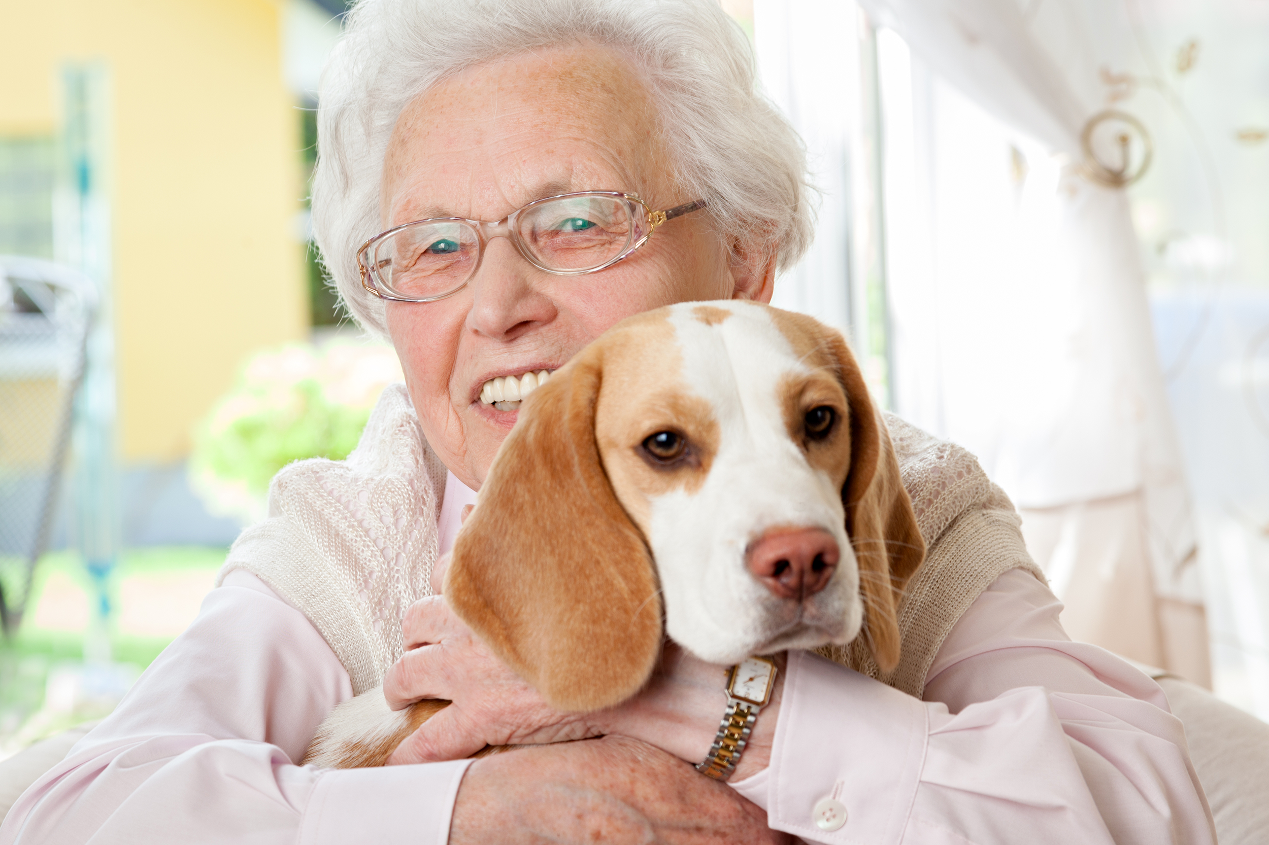 Senior woman holding her dog