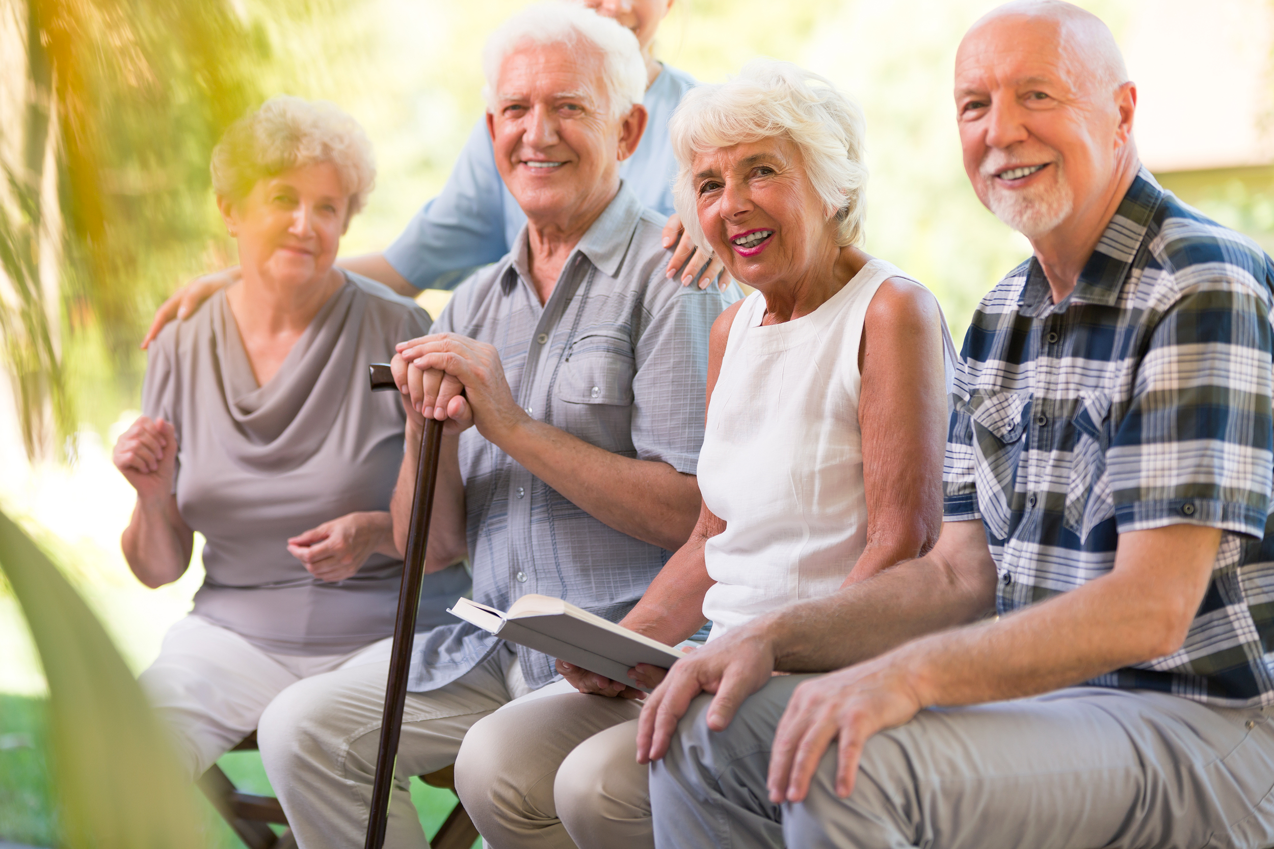 Group of seniors sitting together outside