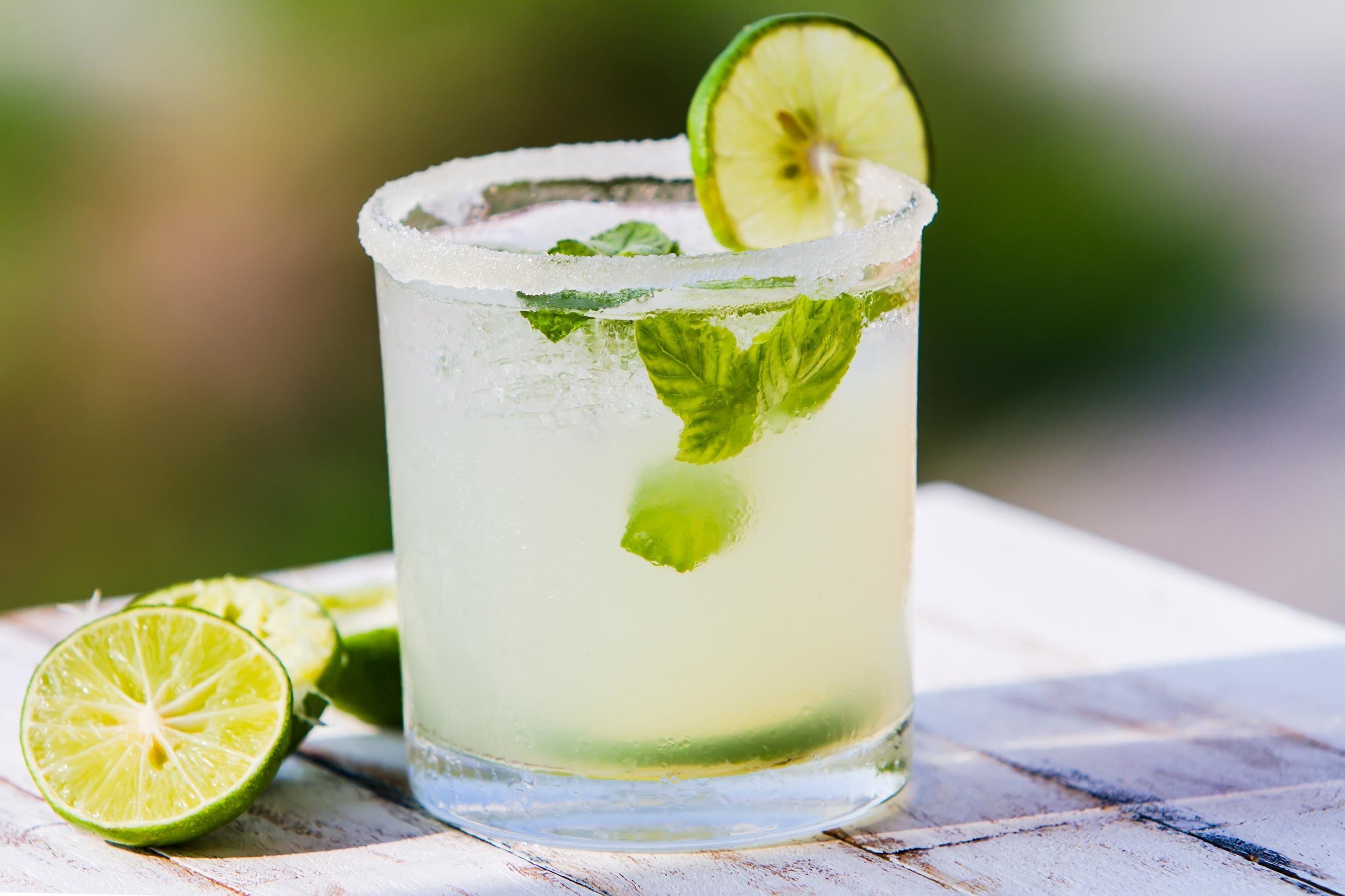 limeade cocktail on wooden table