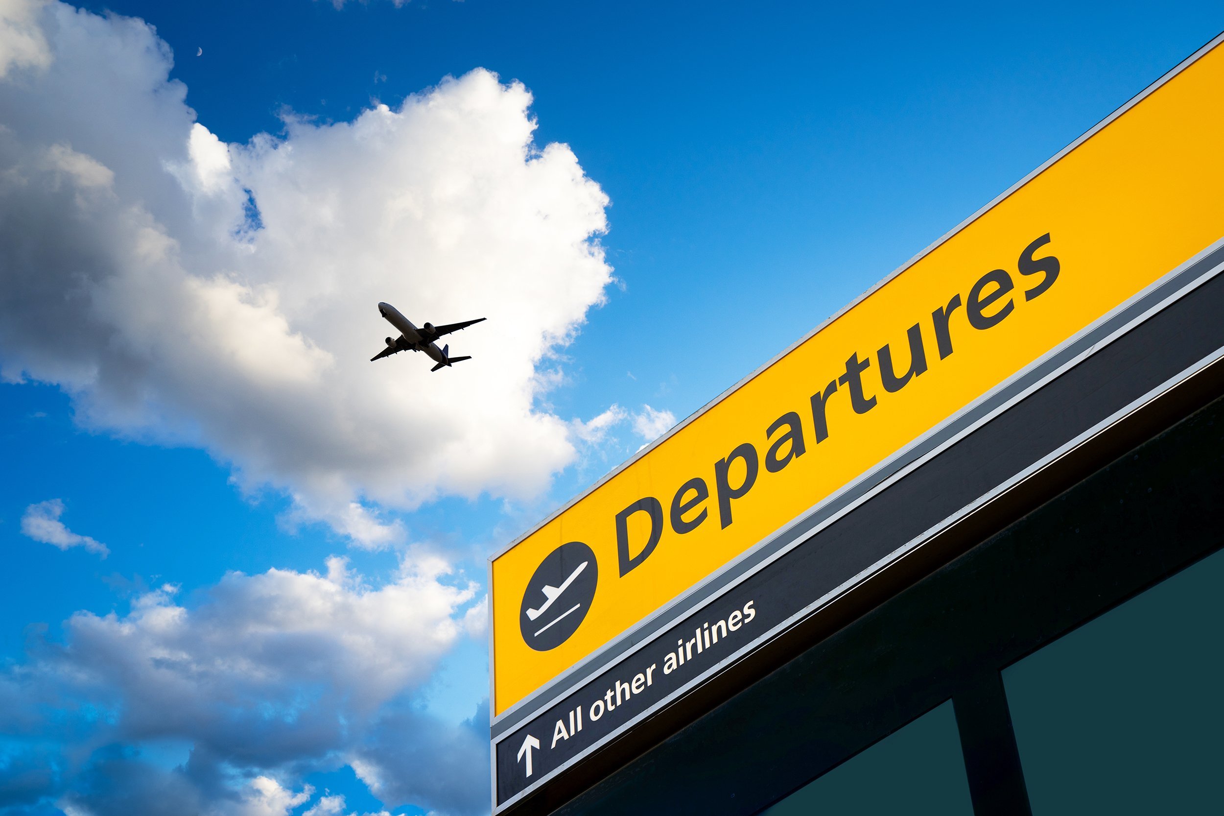 airline and airport departure sign