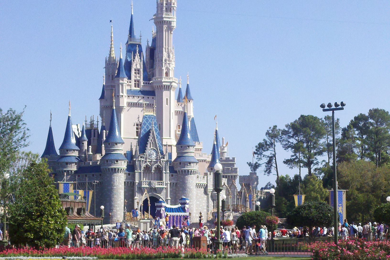 View of crowded Cinderella's Castle at Disney World