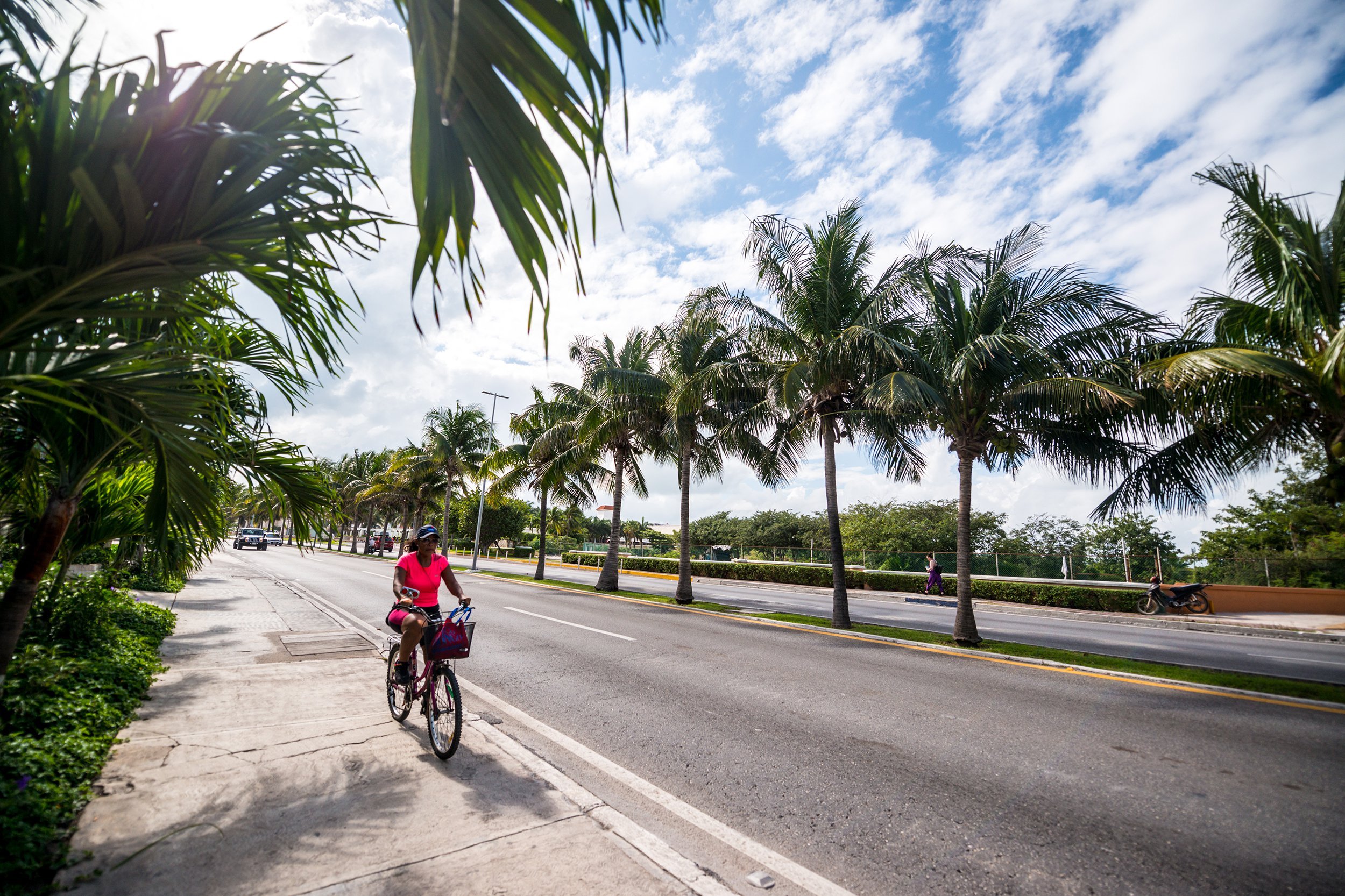 woman cycling in Cancún, Mexico
