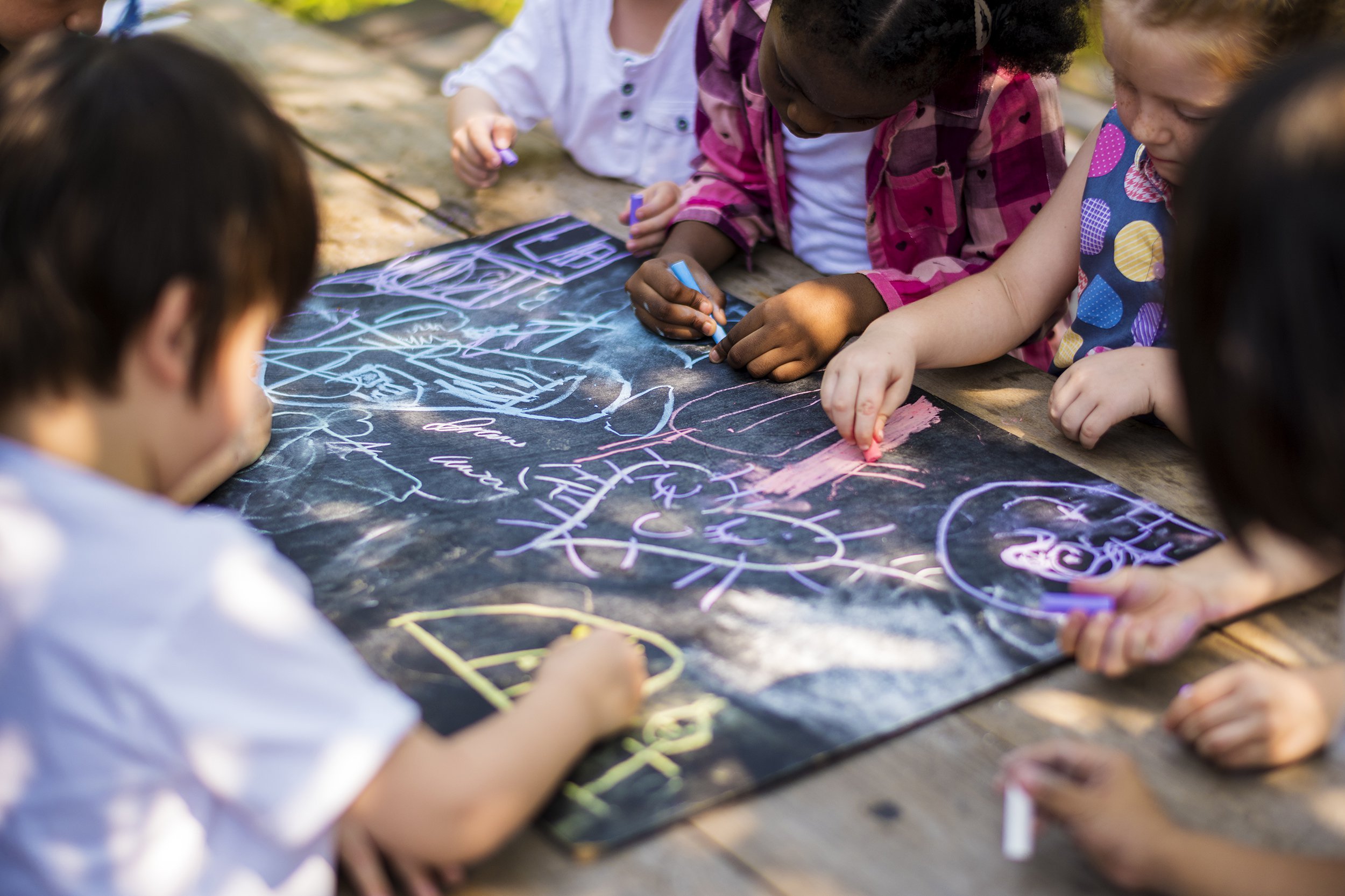 children drawing art class outdoors