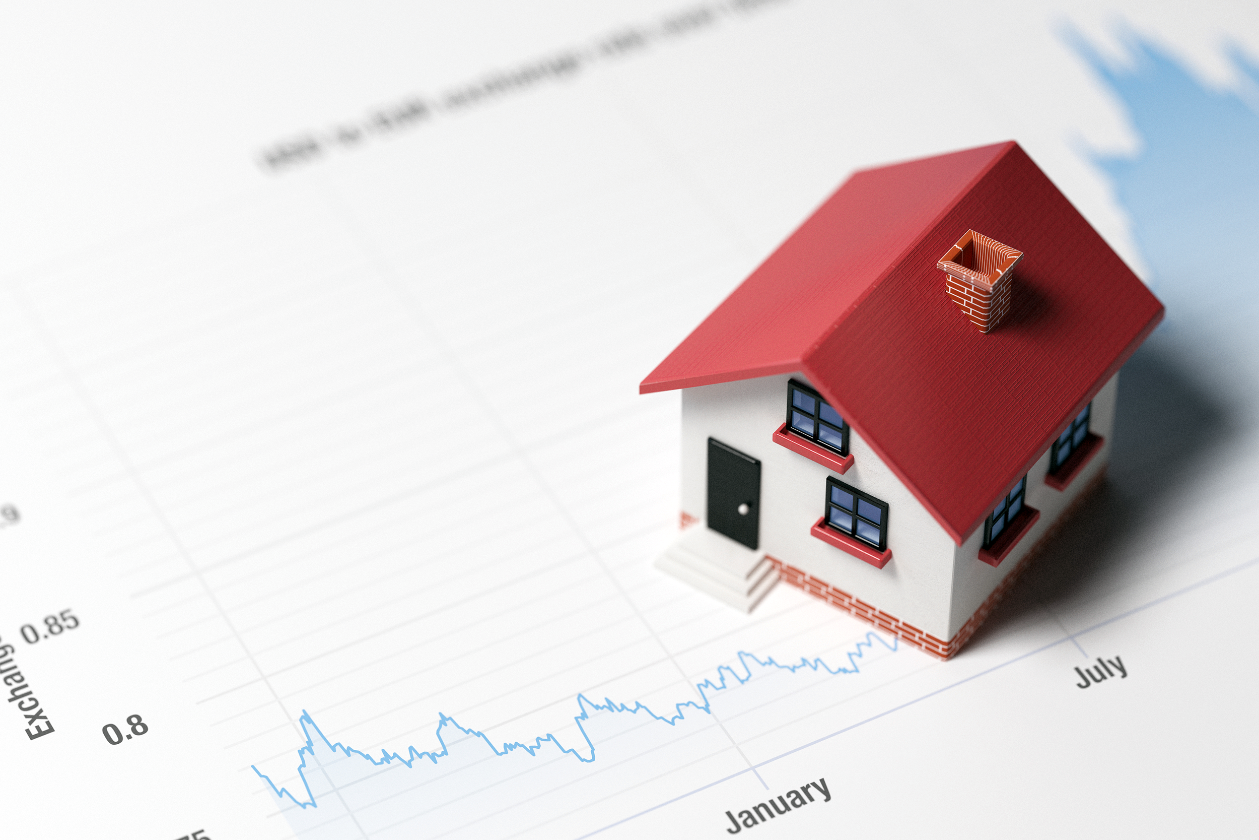 Fluctuating interest rates on a document beneath a model home