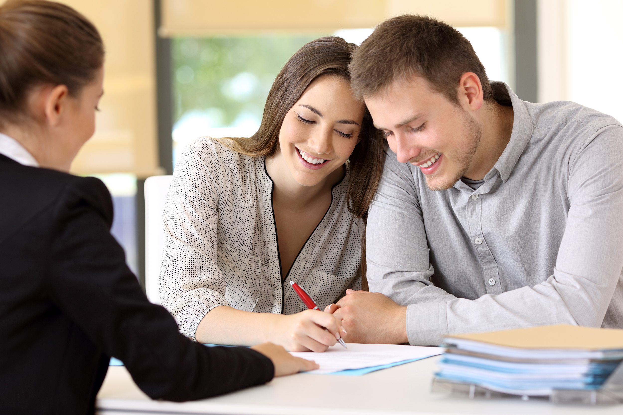 Couple shopping for a mortgage at a lending agency