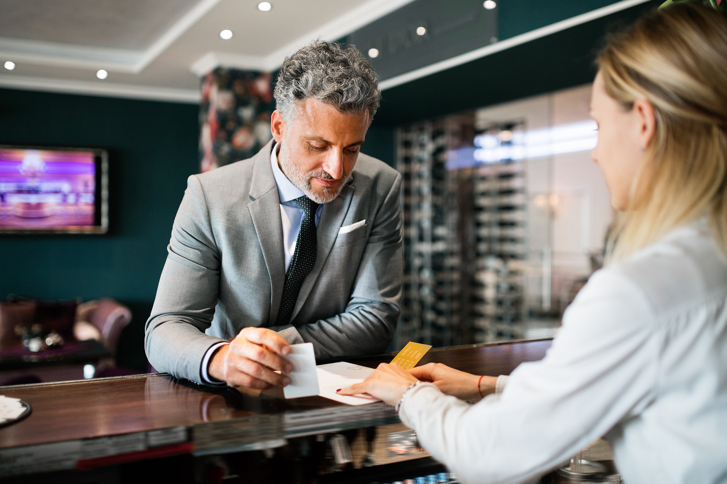 mature businessman at hotel reception