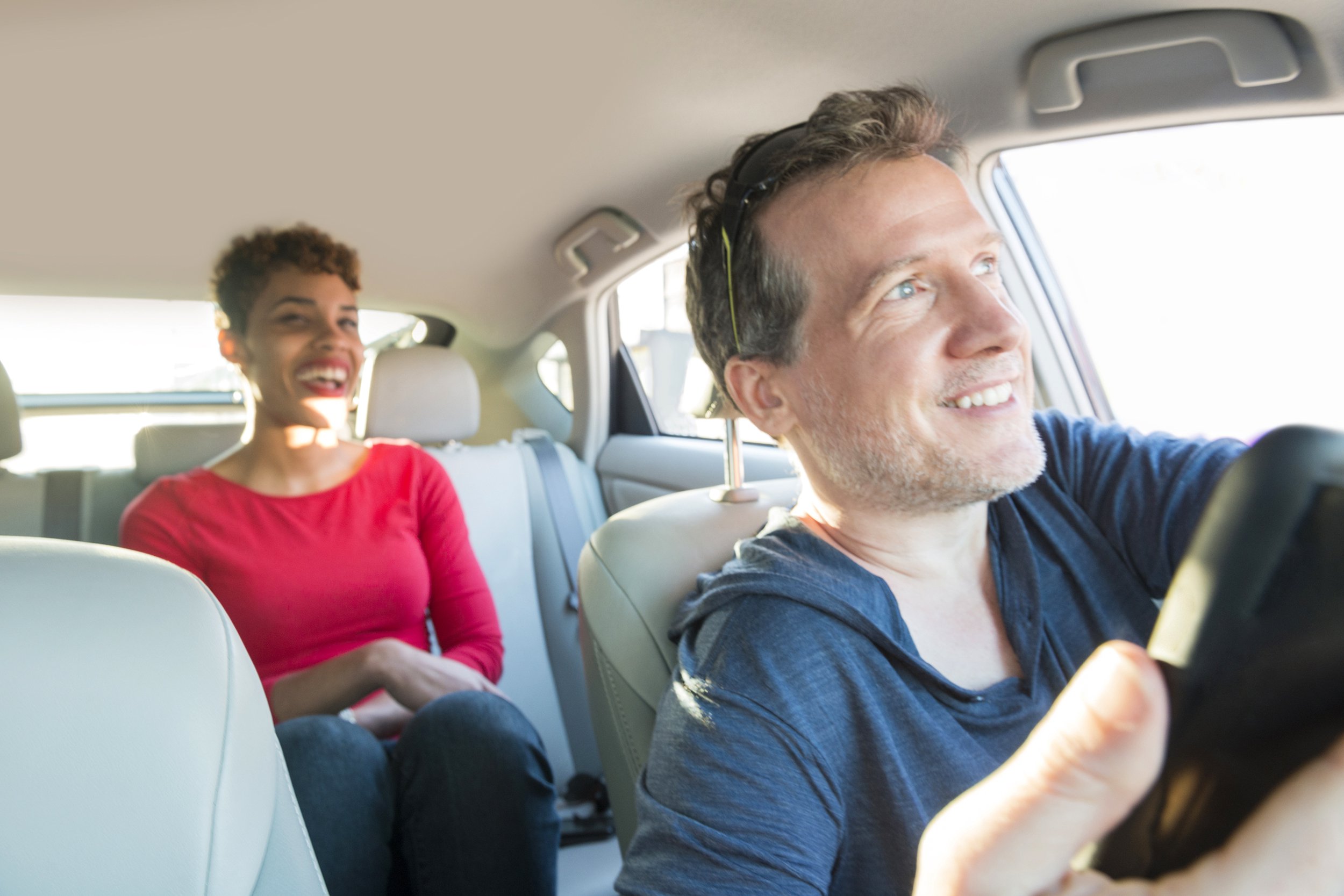 Woman in an Uber with a male driver