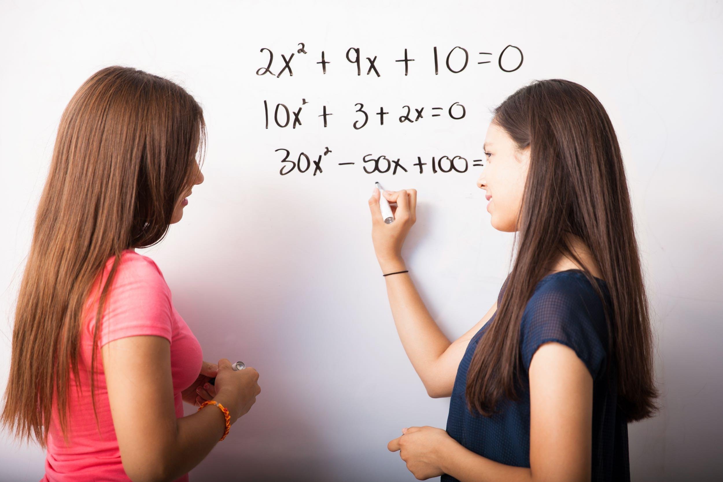 teen tutoring another teen in math