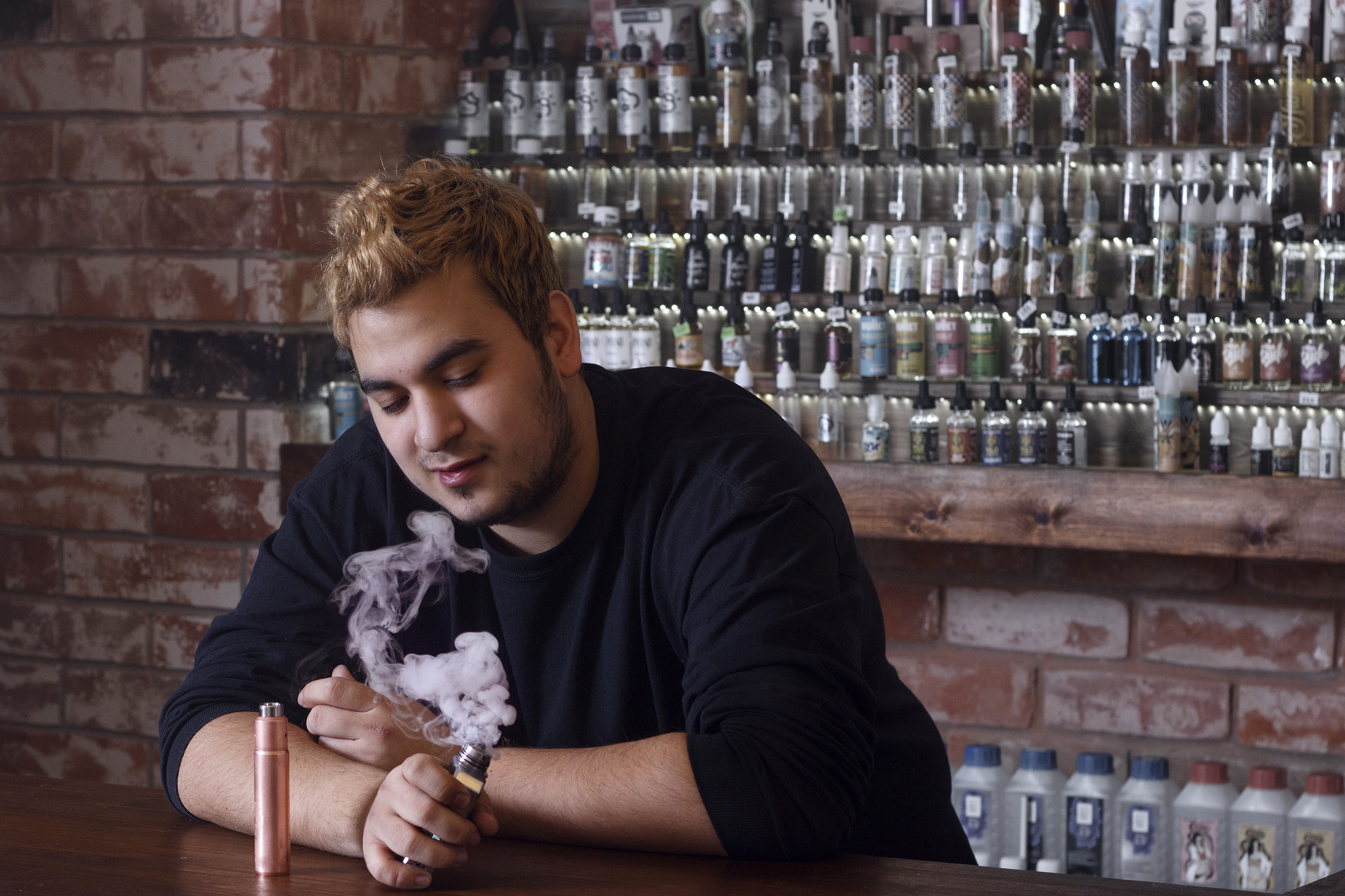 Man vaping in a bar