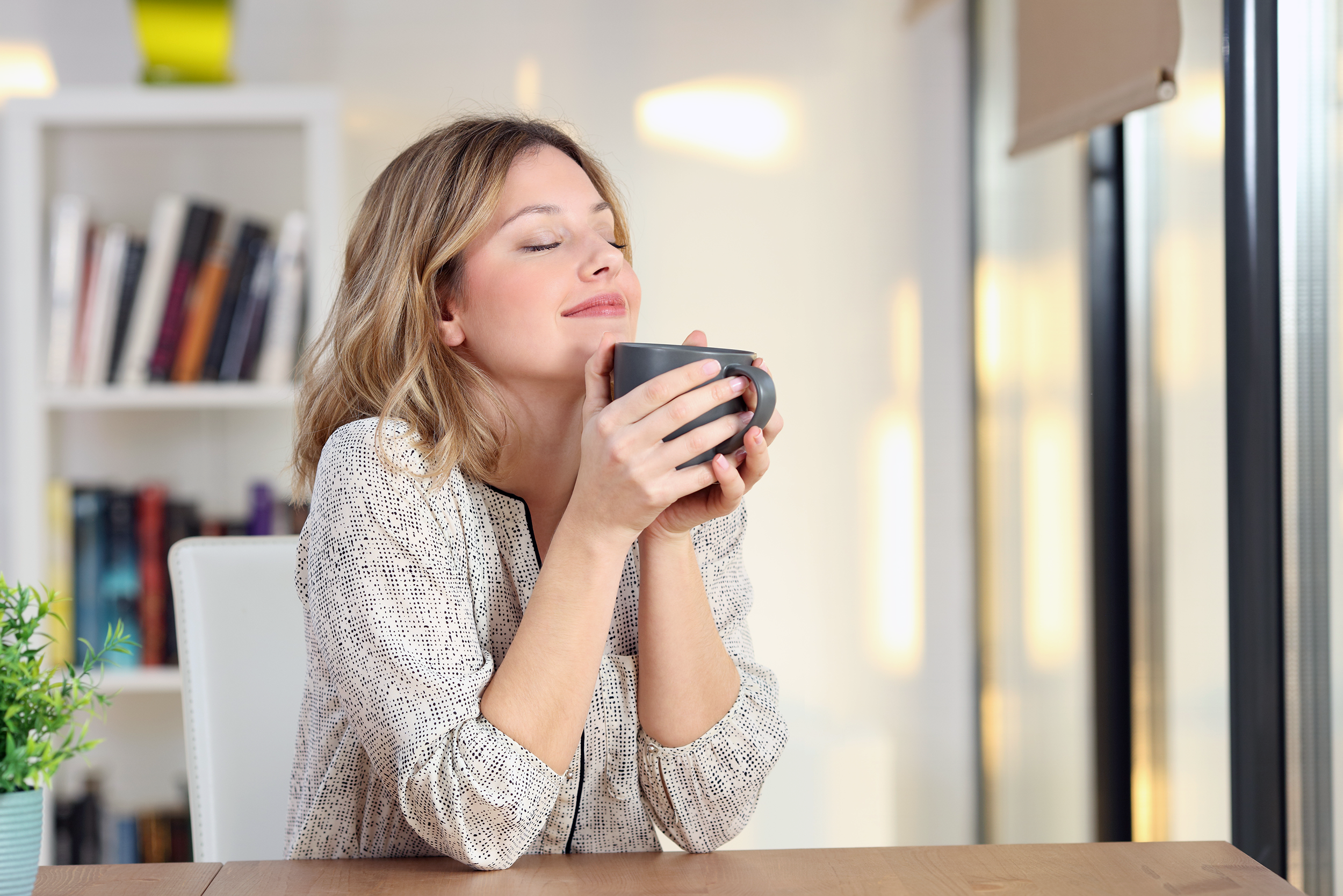 Woman enjoying morning cup of coffee