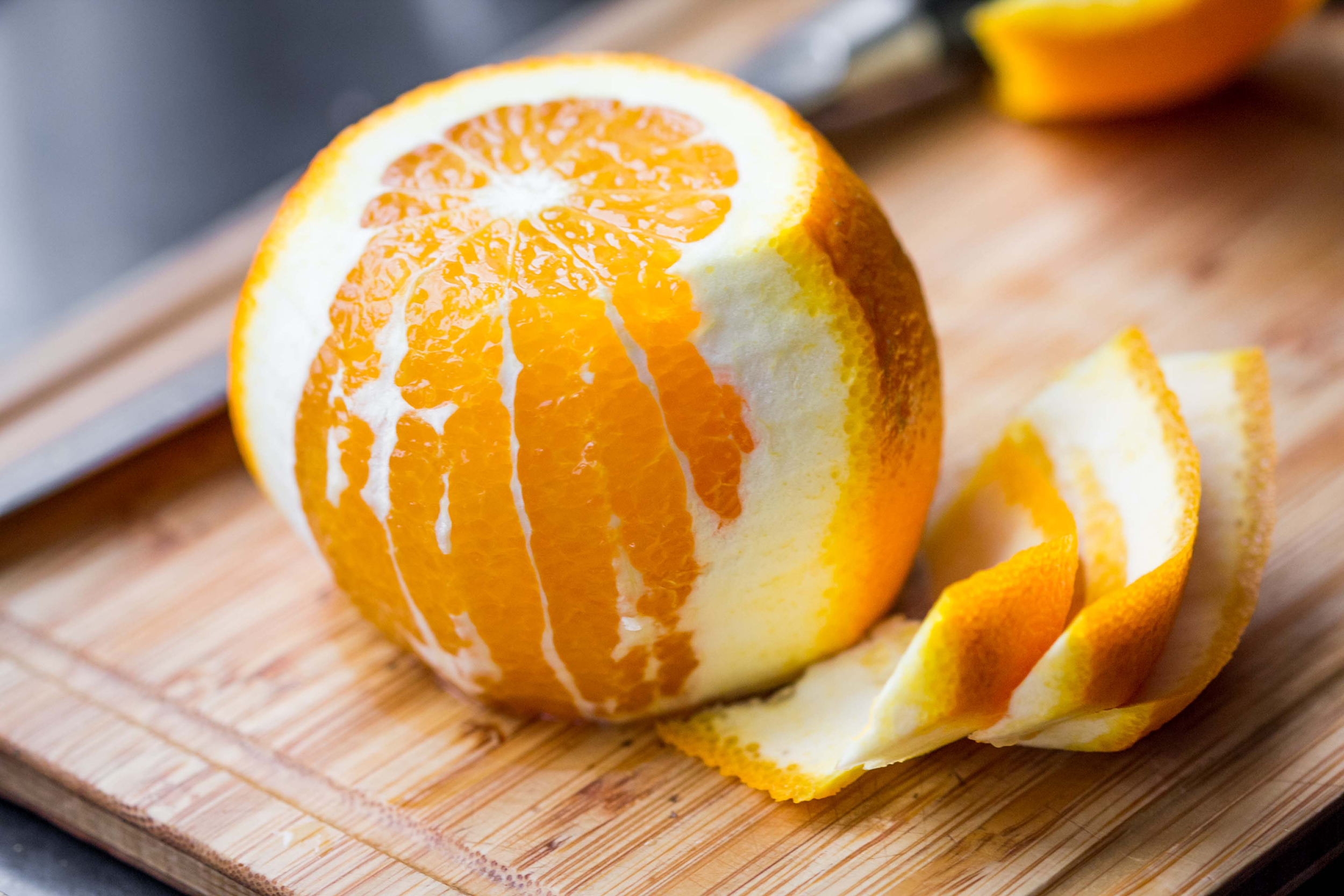 Peeled orange on a cutting board