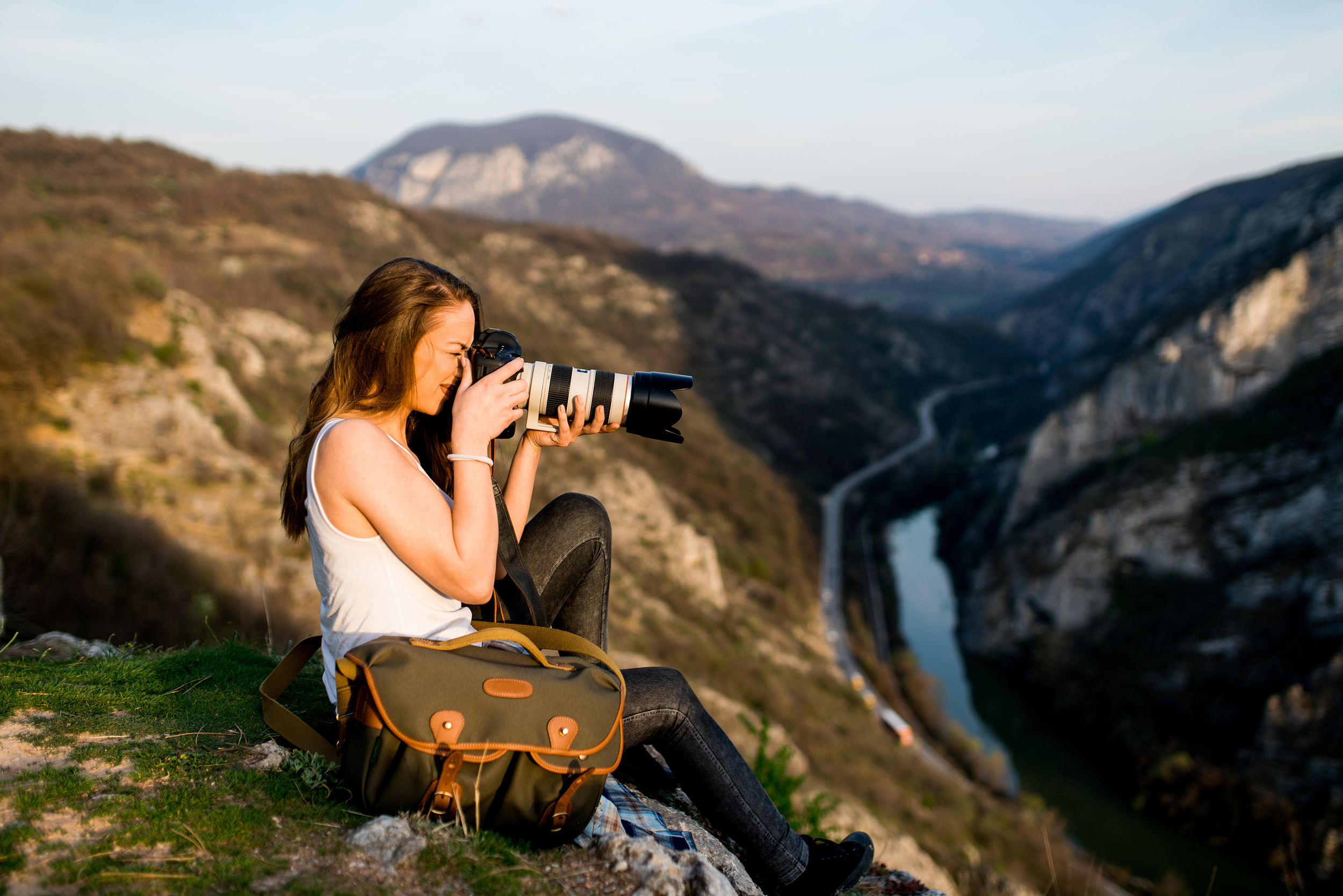 Photographer taking photos on a mountainside