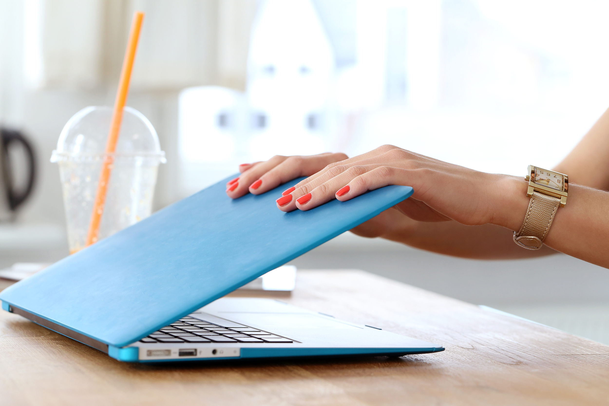 Woman closing her laptop