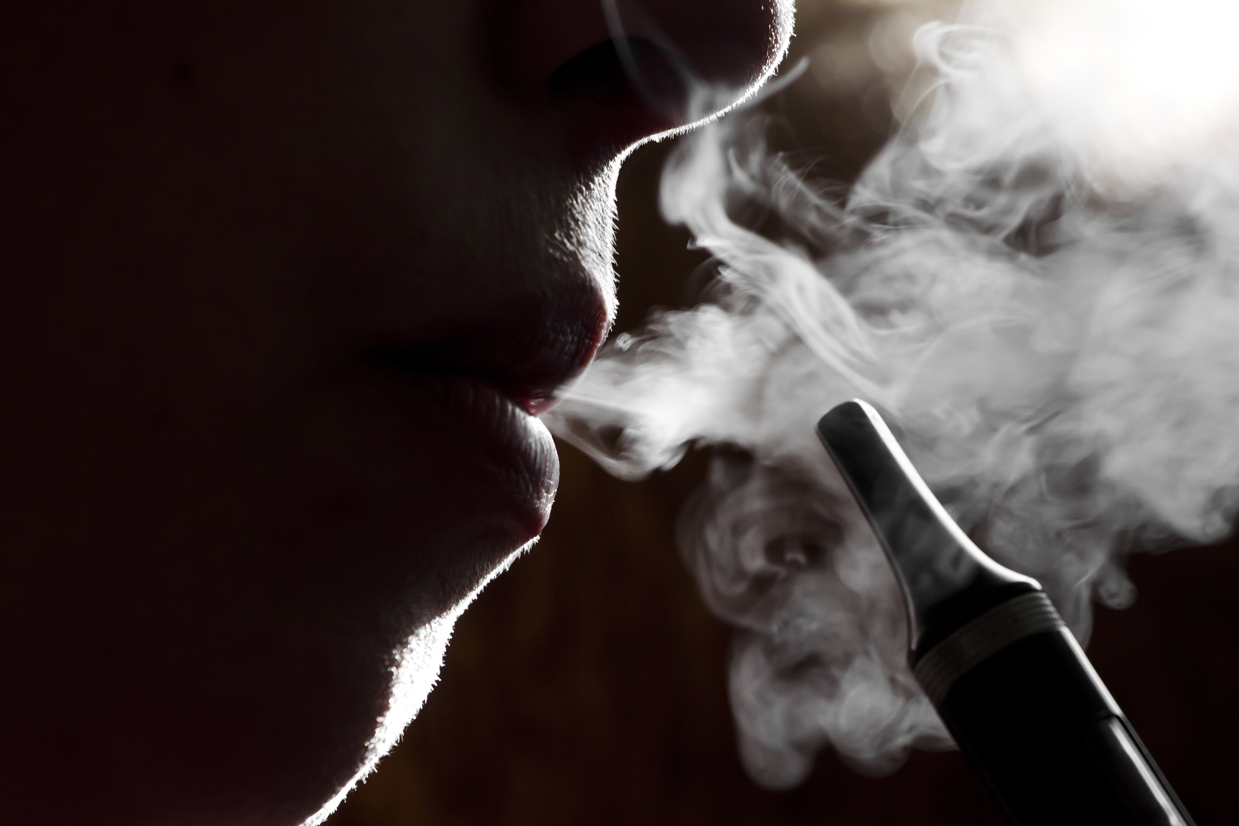 Man blowing smoke from a vape