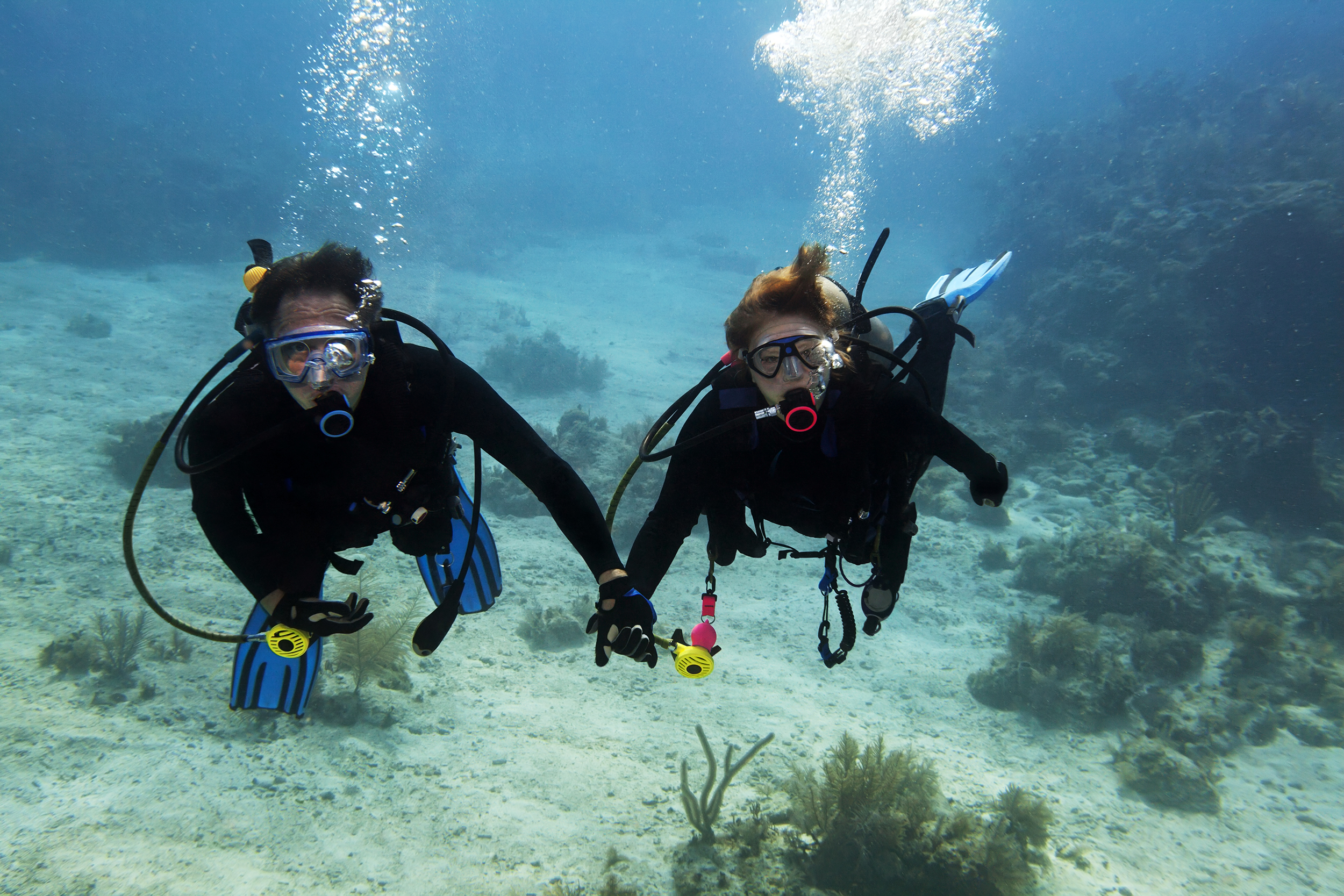 Scuba instructor with a student in the ocean
