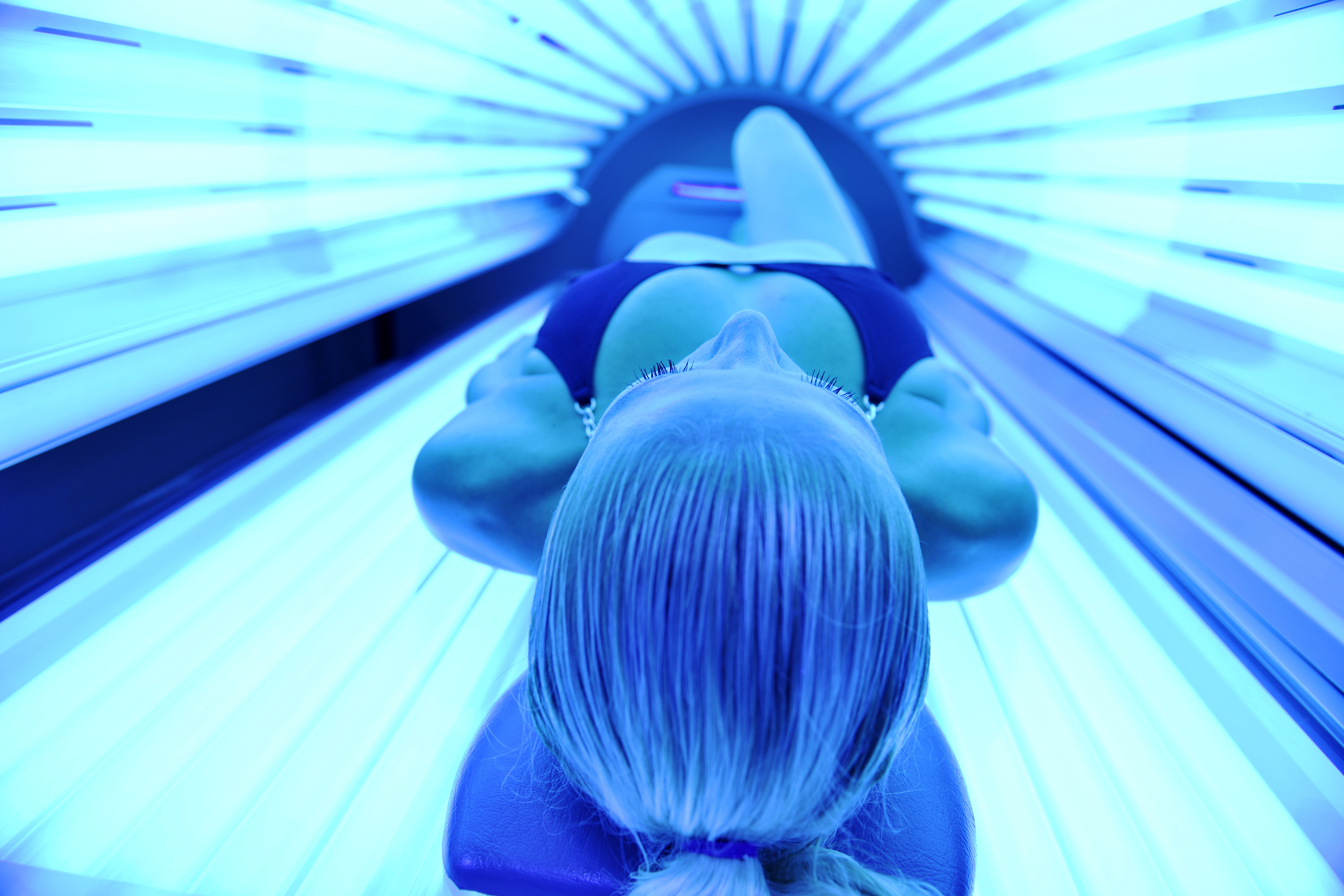 Woman in a tanning bed