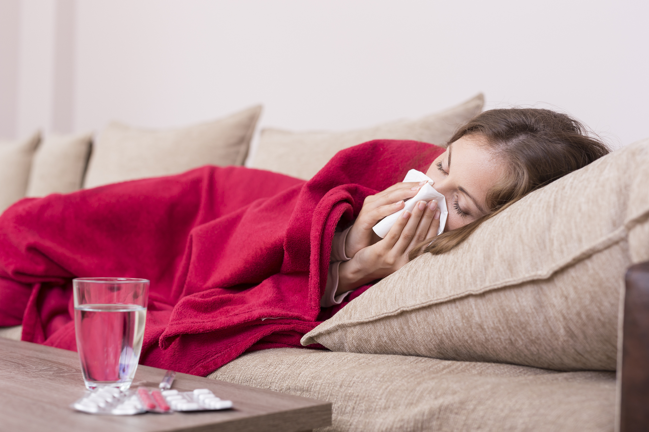 Woman sick on the couch