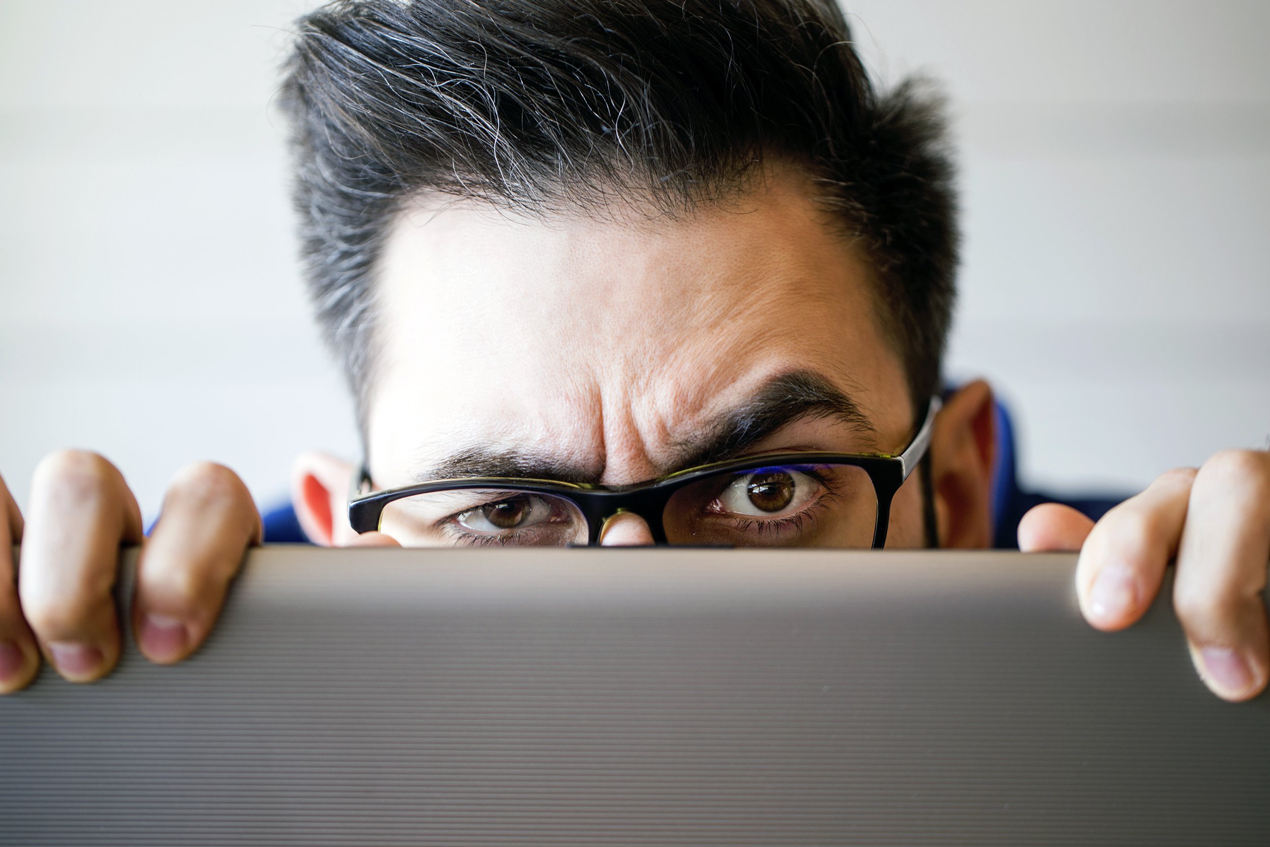 computer hacker stealing information with laptop