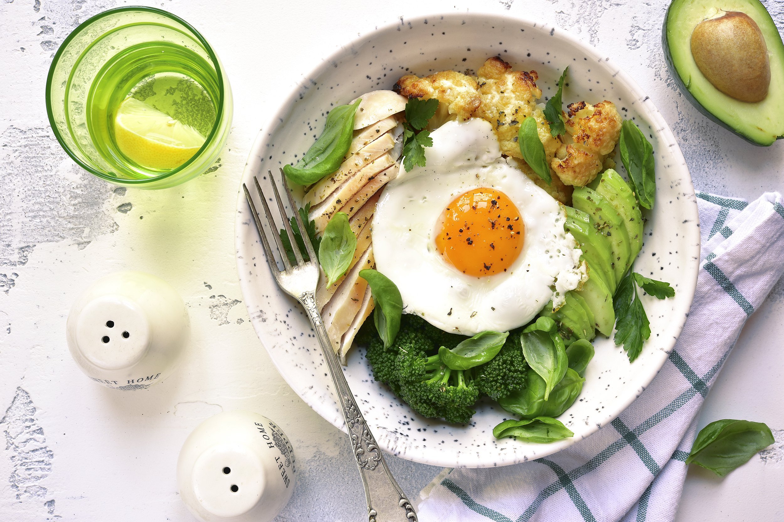 dinner bowl with meat, fried egg, and vegetables