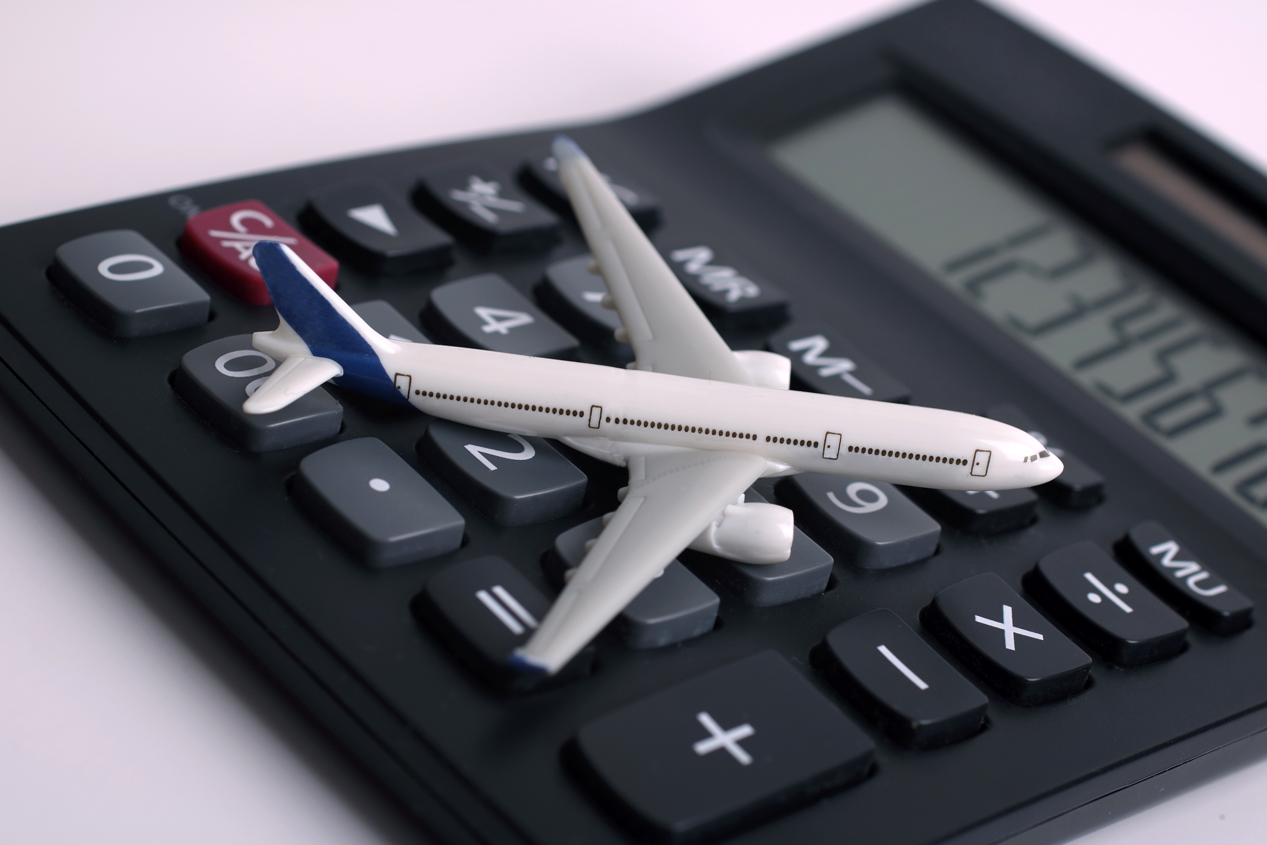 Model airplane on a calculator