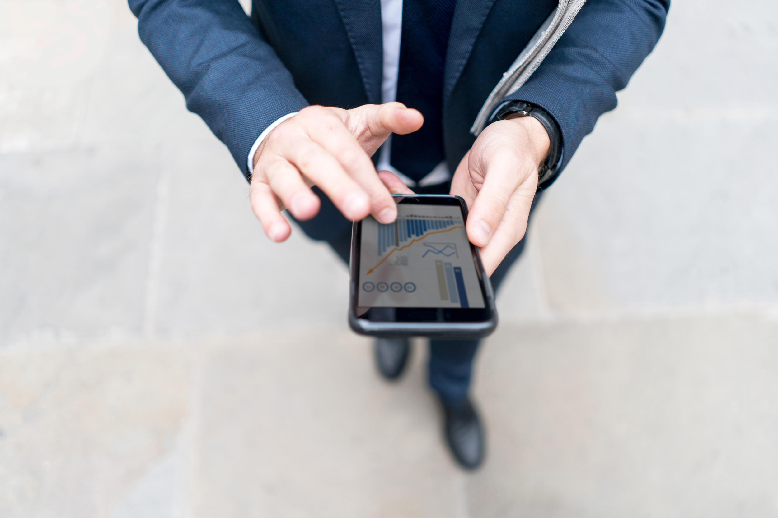 Man checking stock market app