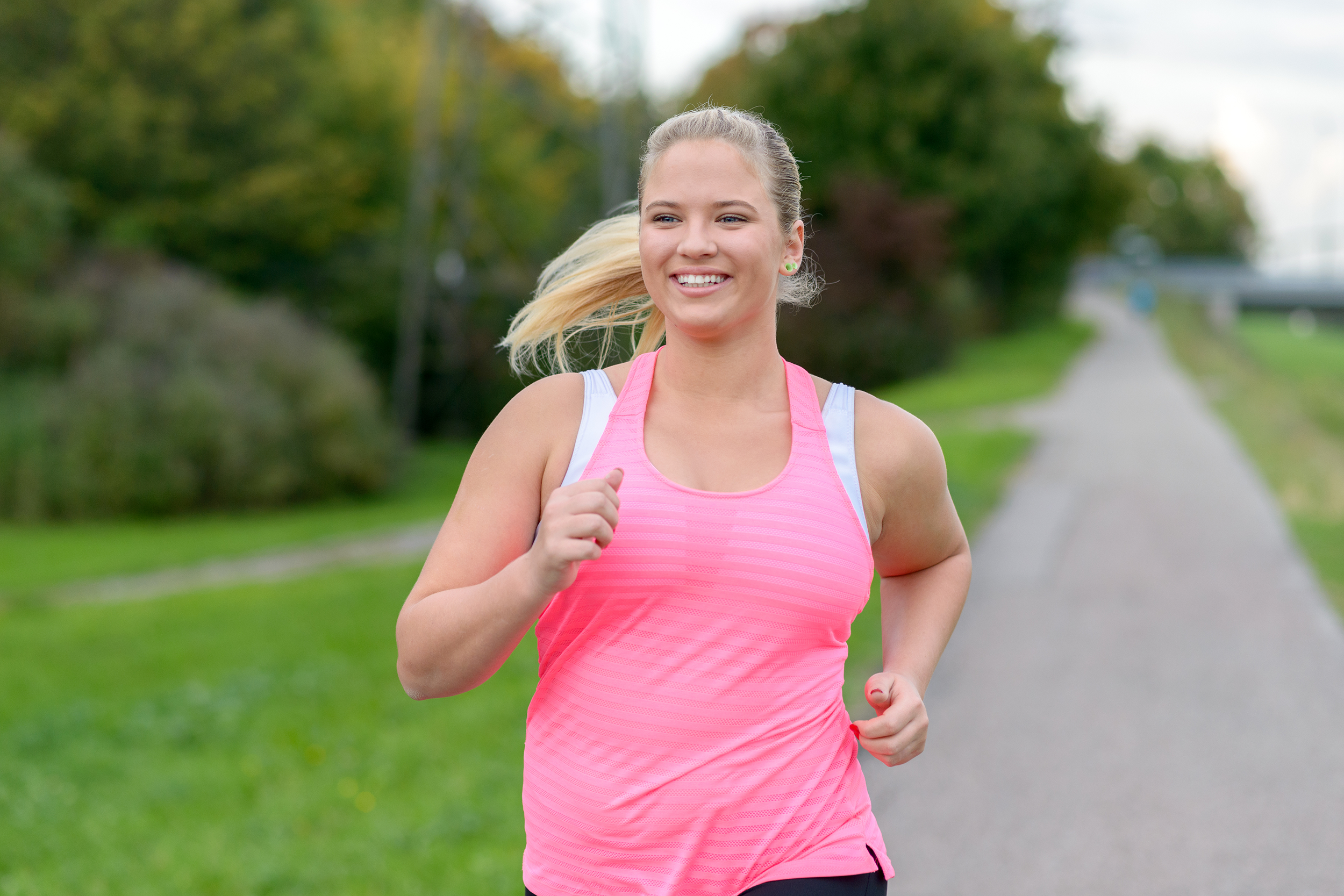 Young woman jogging outside