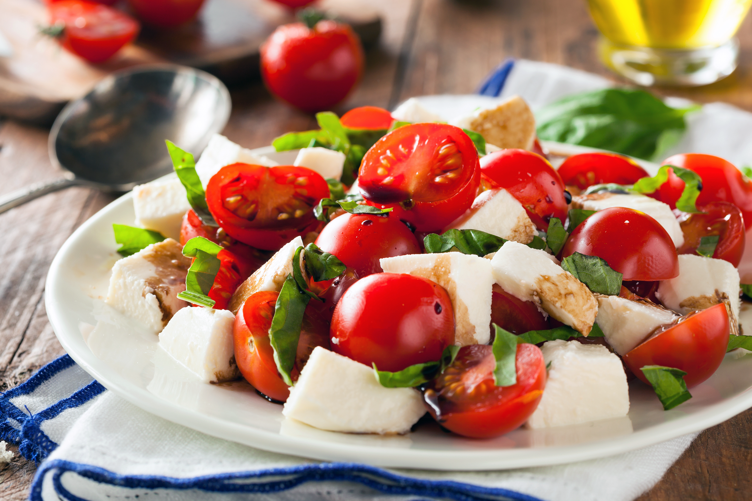 Caprese salad with cherry tomatoes, mozzarella, and basil