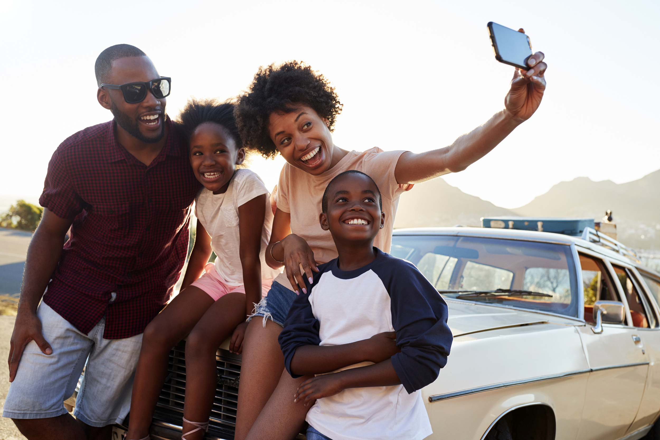 Family taking a selfie on a road trip