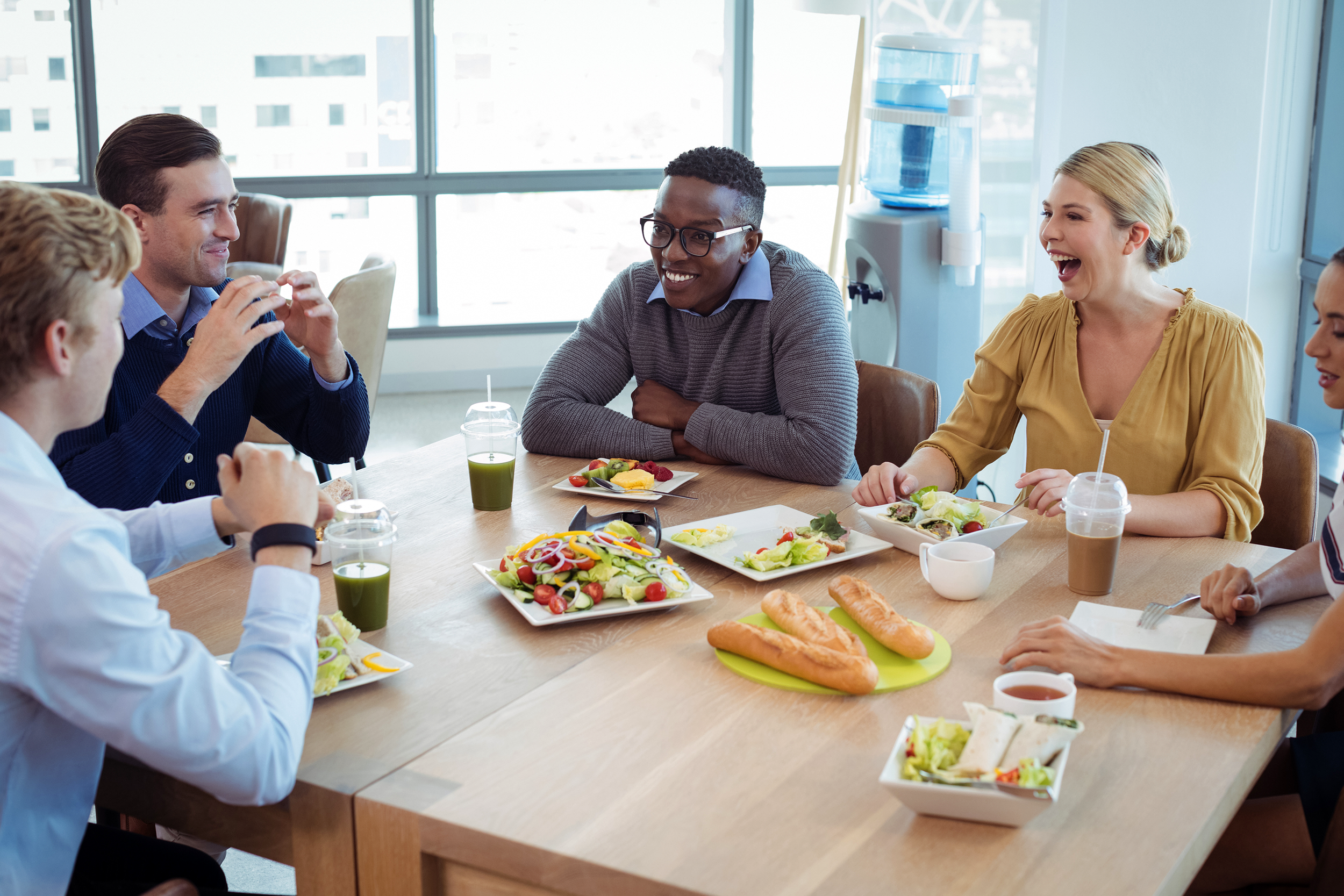 Employees enjoying company lunch together