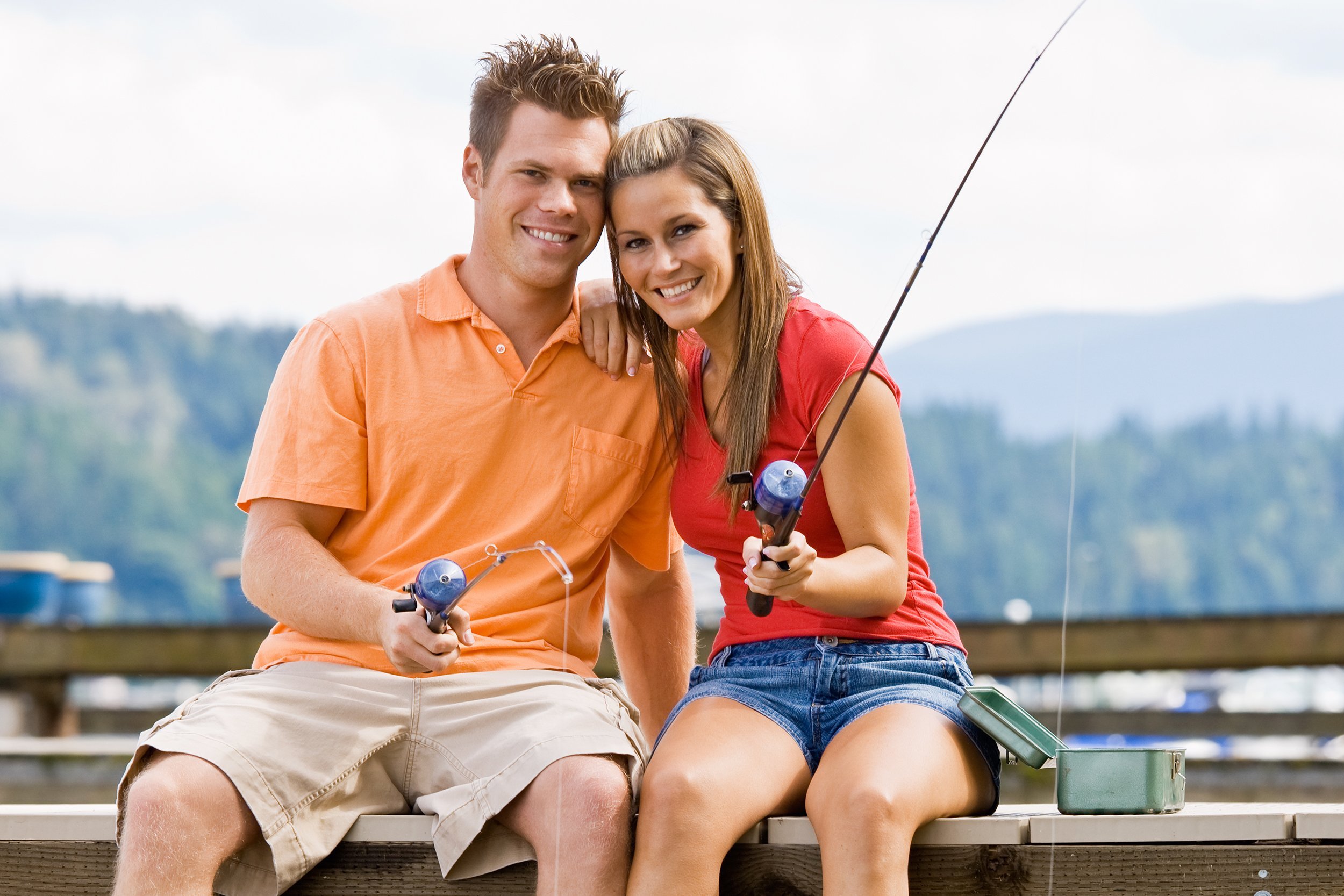 couple fishing on pier