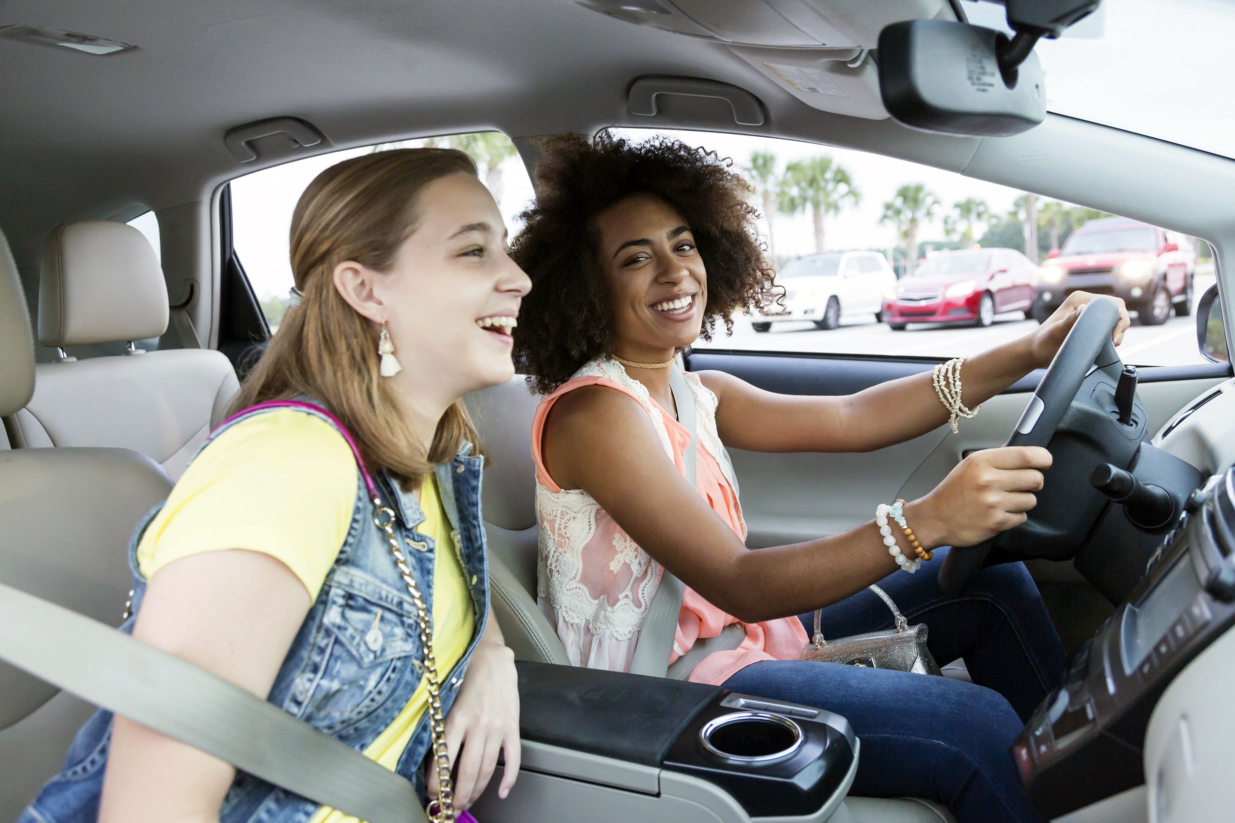 two teen girls driving car