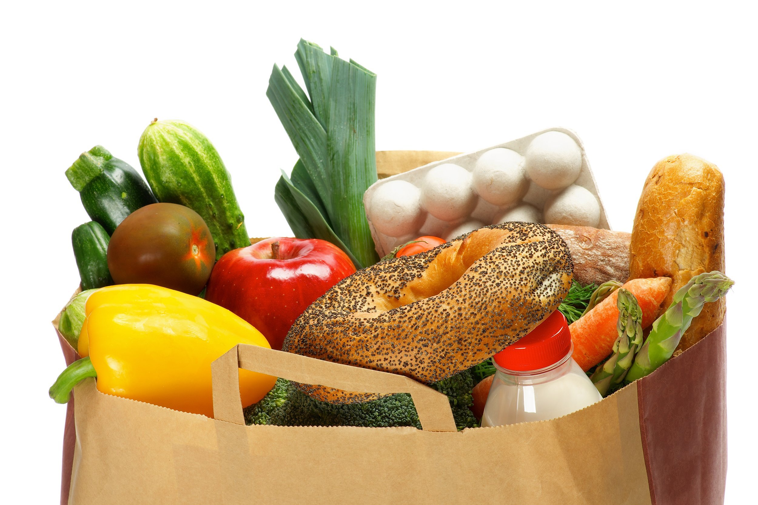 groceries bag with vegetables, bread, greens, fruits, bottle of milk and container of eggs
