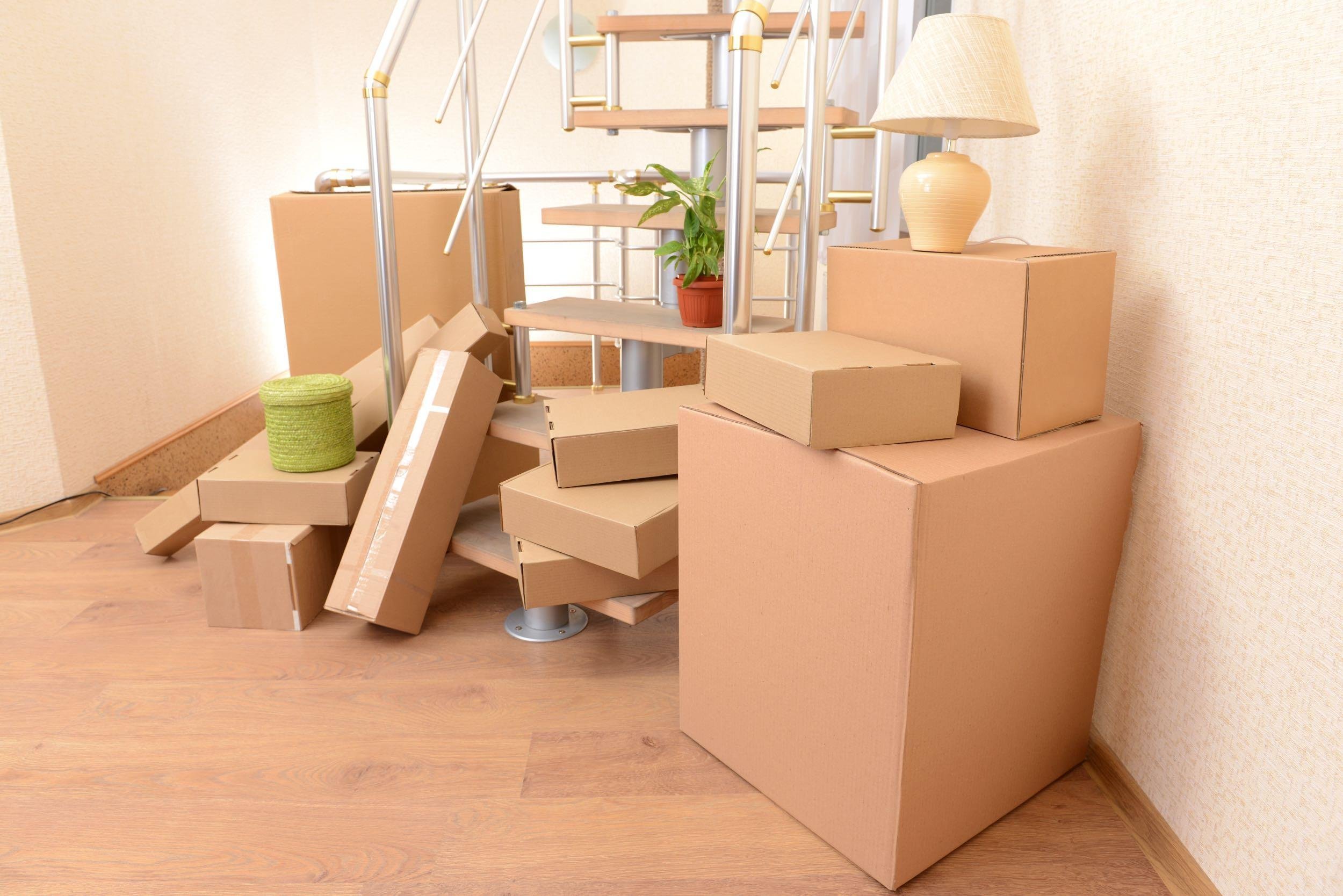 stack of cartons near stairs